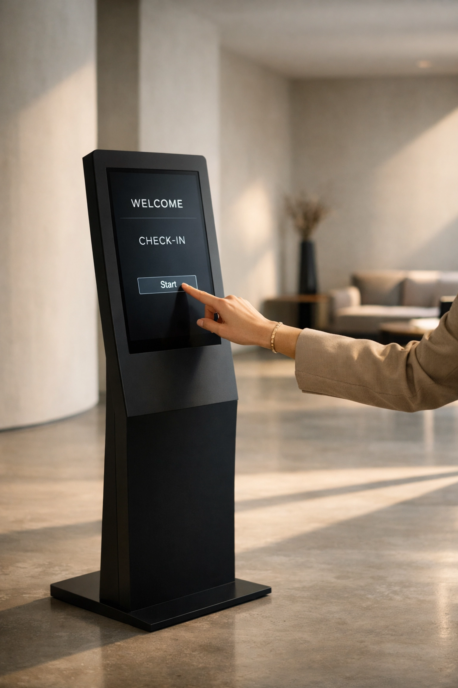 Guest using a sleek hotel self-check-in kiosk terminal for a seamless lobby experience.