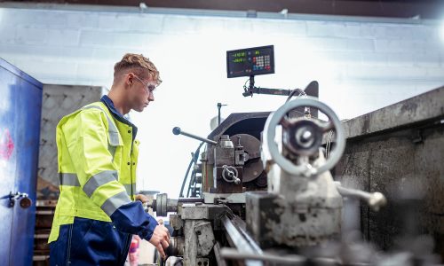 Engineer Operating Precision Lathe