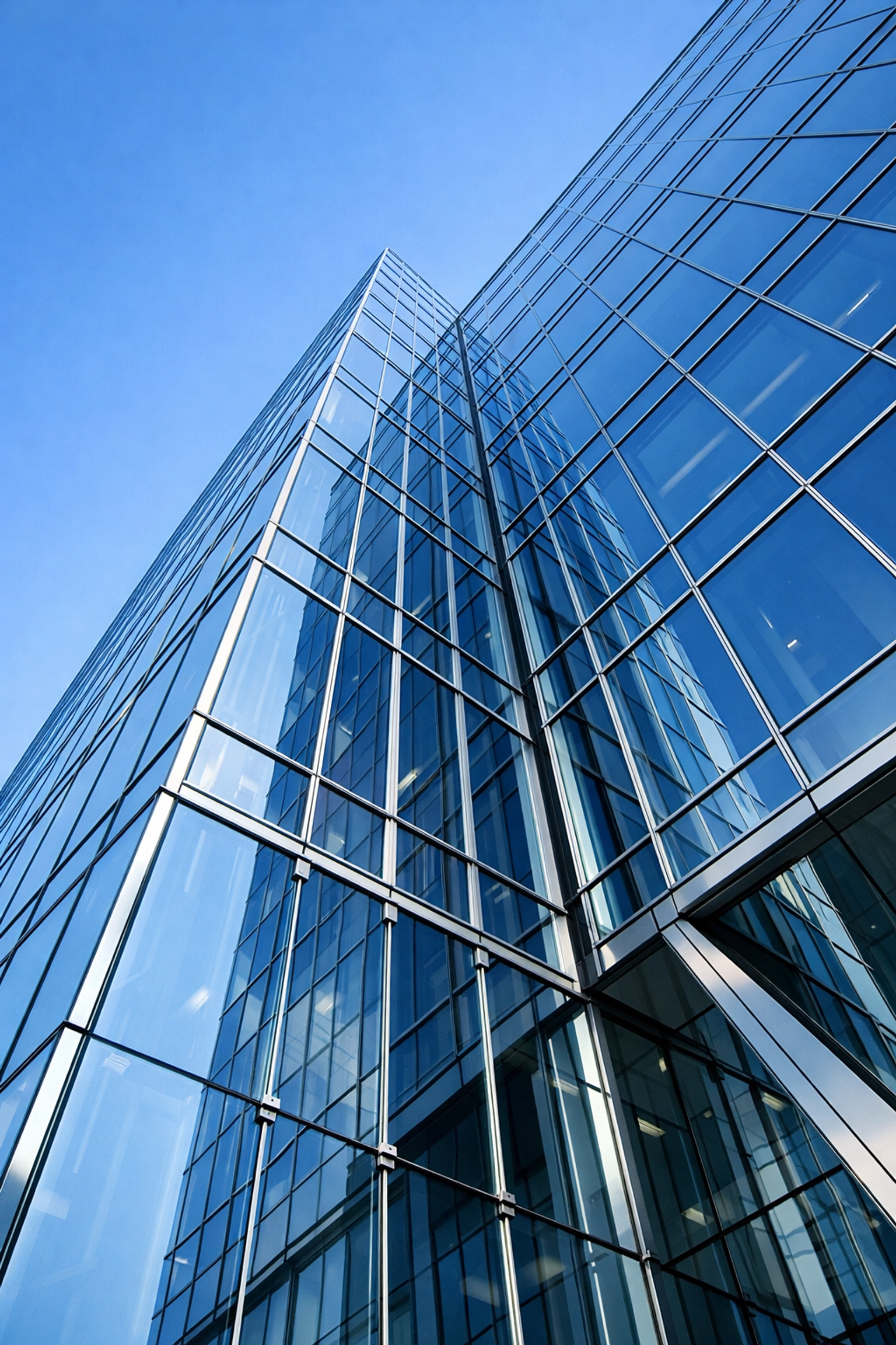 Pristine glass facade of a modern office building representing reliable commercial janitorial services.