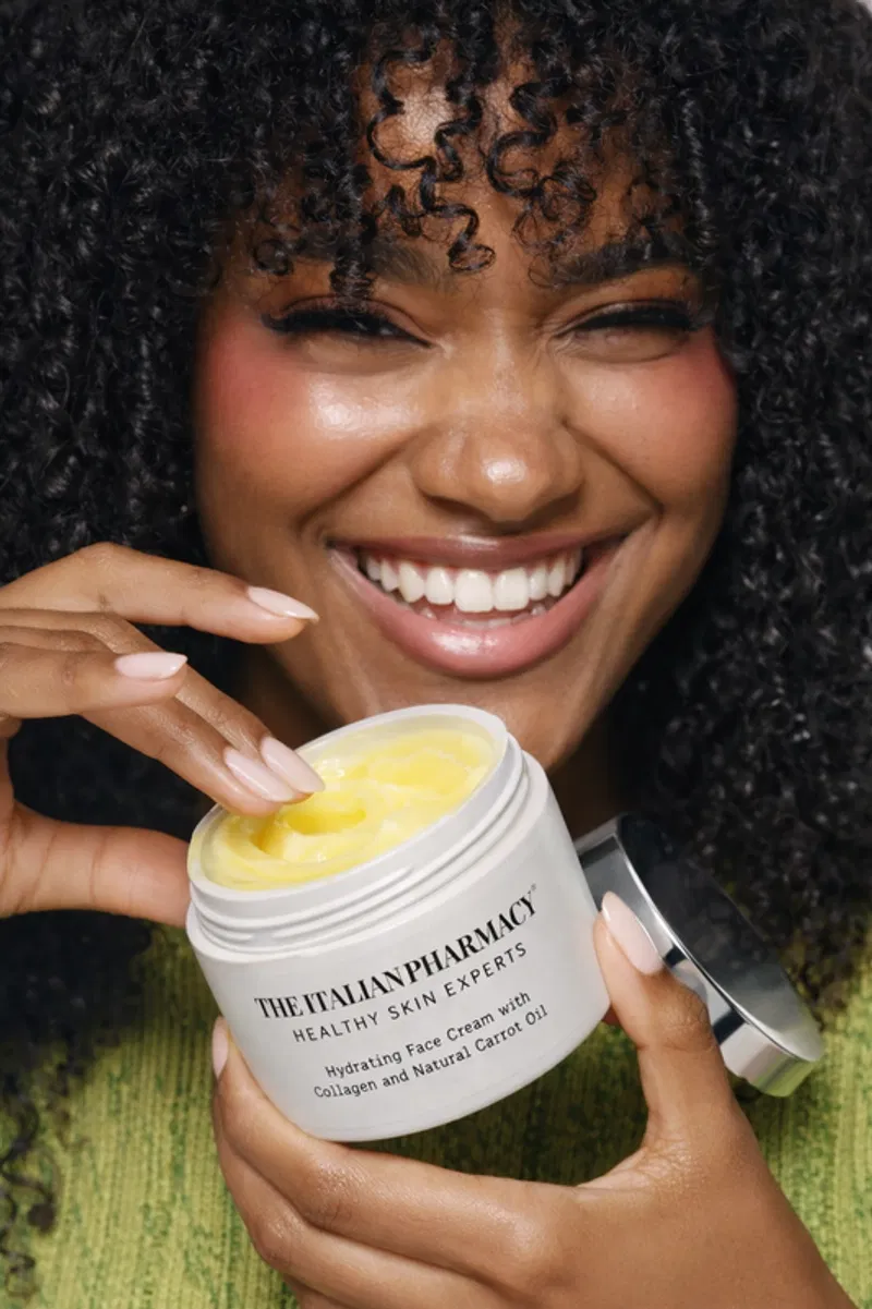 Woman applying The Italian Pharmacy carrot cream