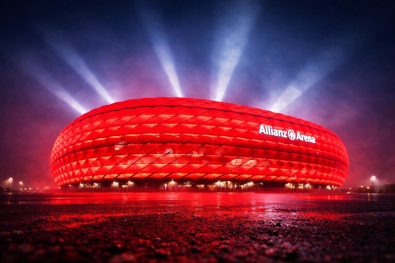 Allianz Arena at night illuminated in red for Bayern München Champions League match
