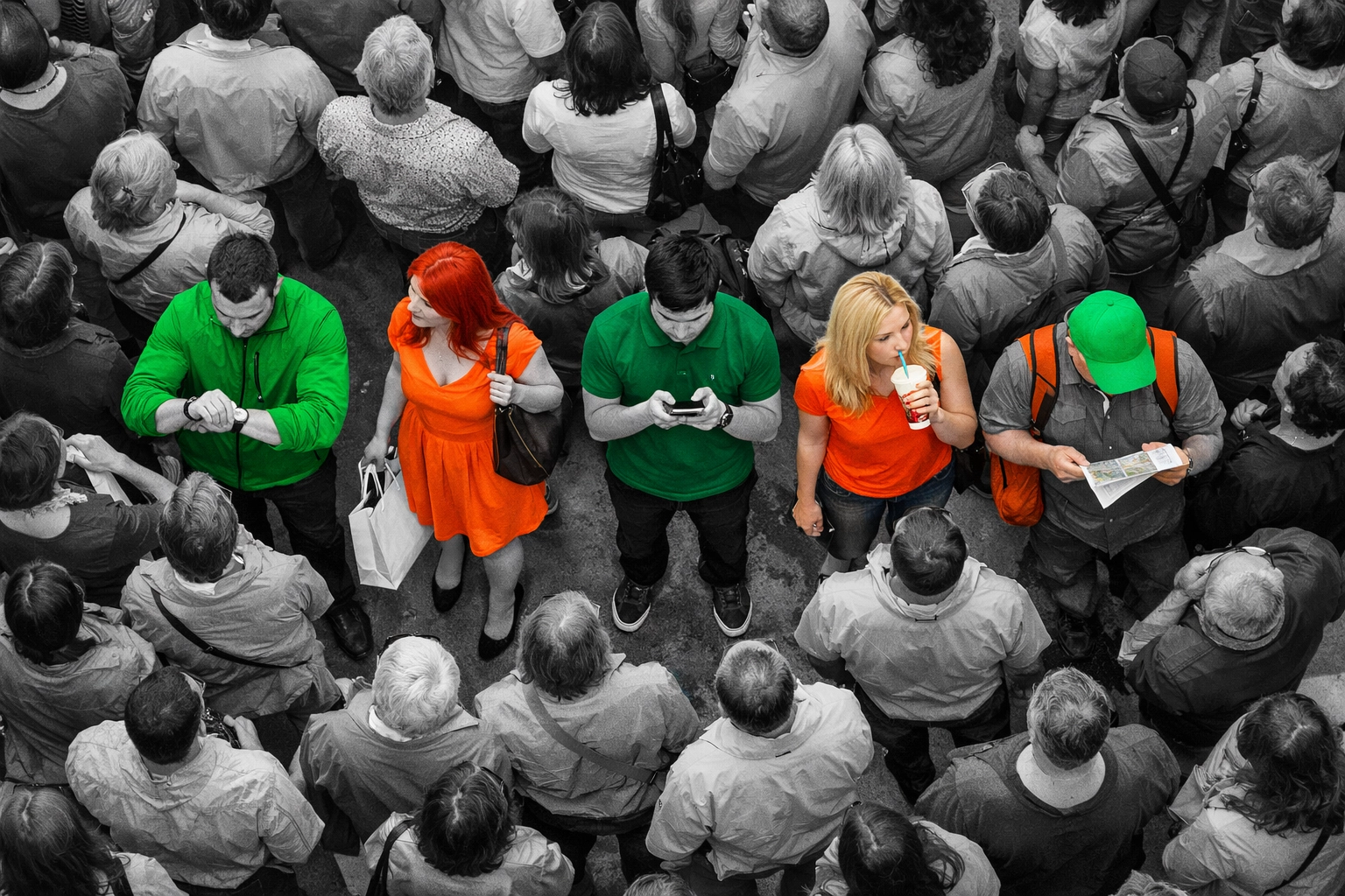 High-angle view of a crowd with highlighted individuals representing behavioral segmentation and targeted marketing.