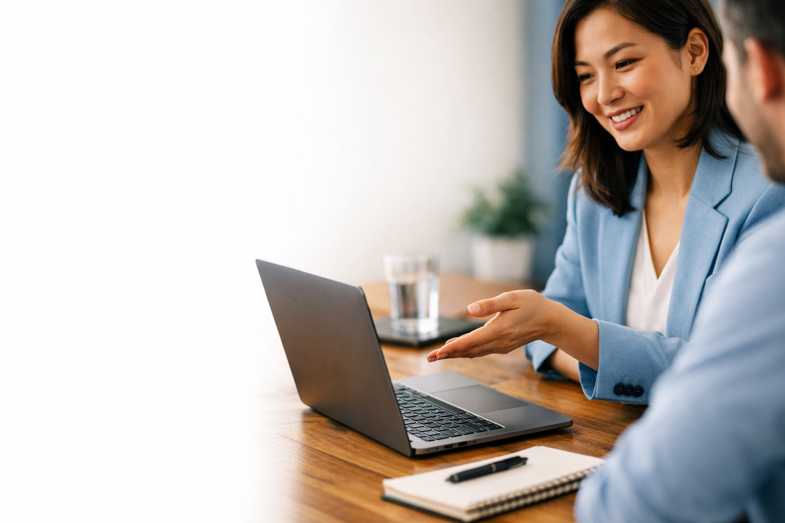 Professional collaborating in a modern workspace, highlighting the use of company tools versus contractor equipment.