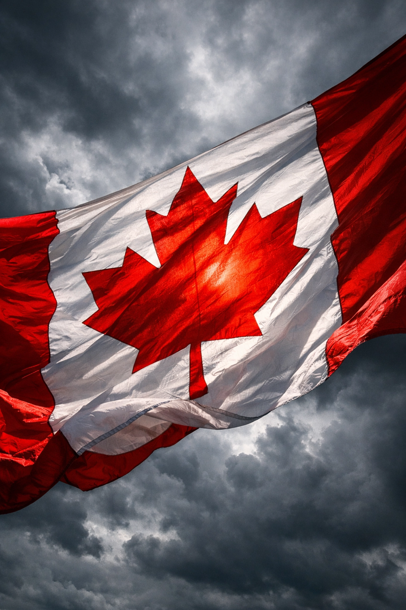 Canadian flag waving against stormy sky representing national unity and identity