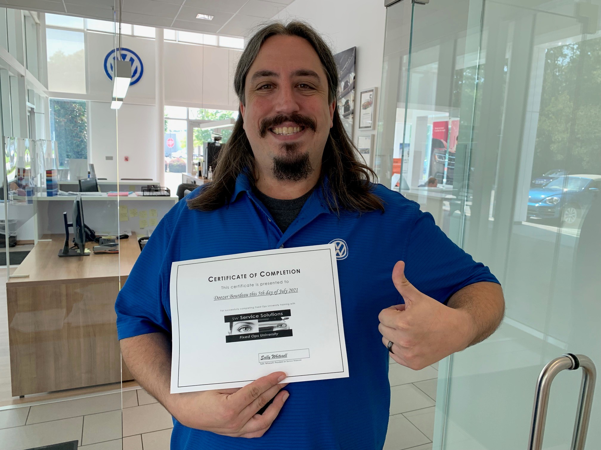 Service advisor with Fixed Ops University certificate