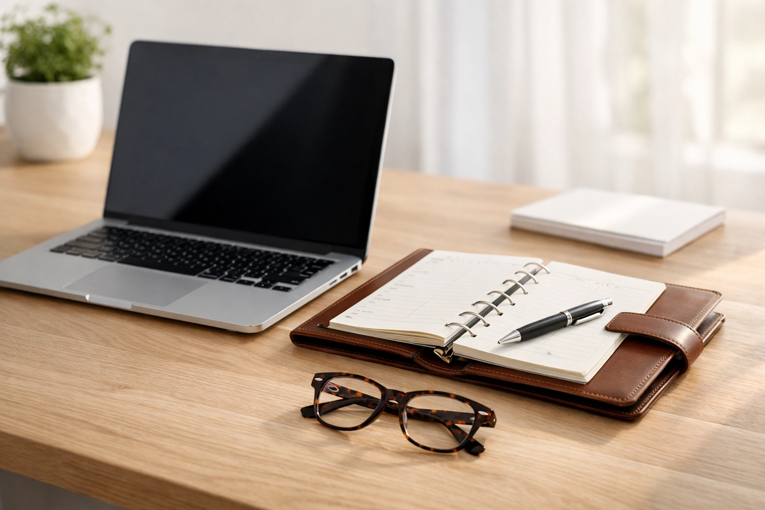 Professional desk setup featuring tax professional tools and IRS PTIN registration.