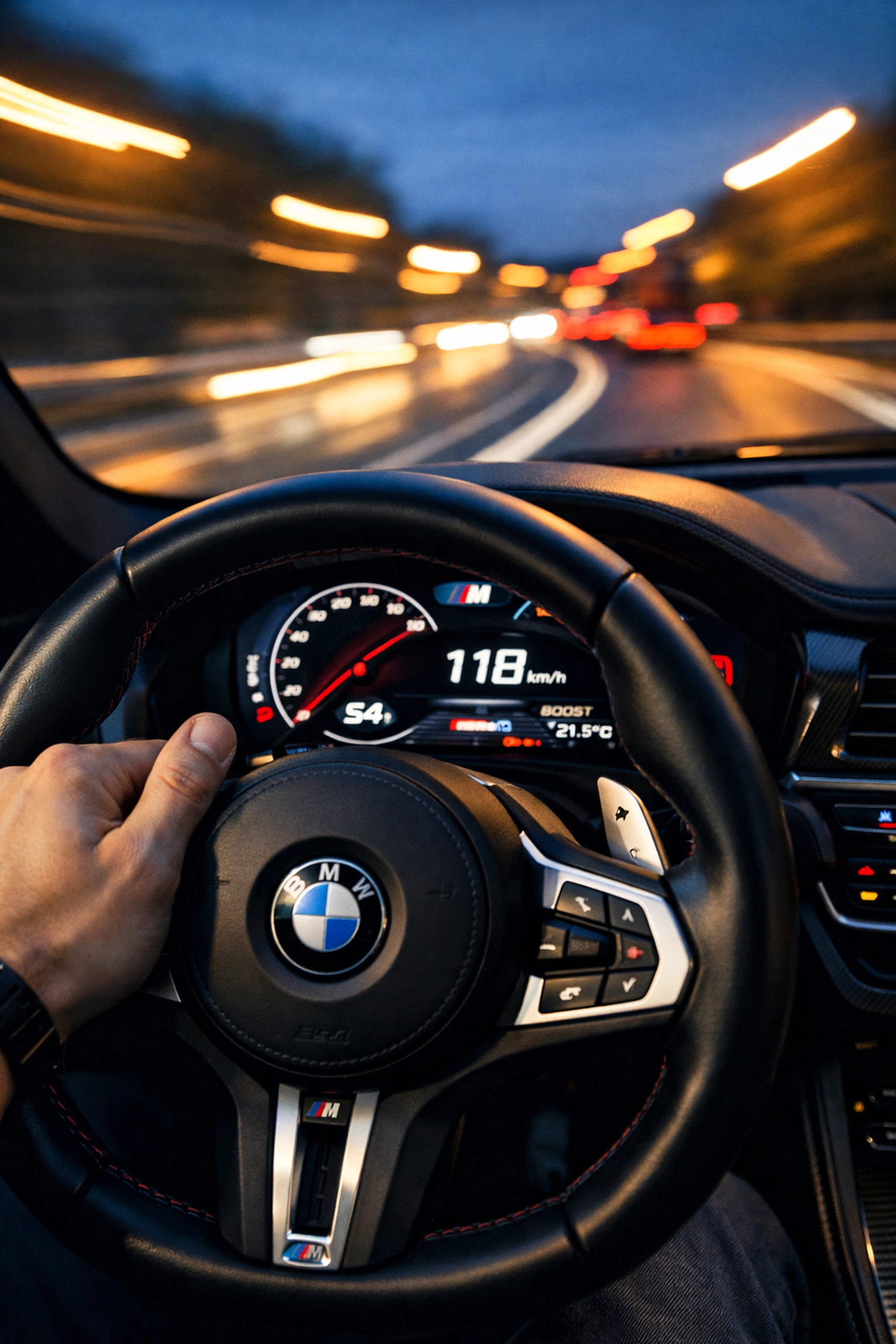 Driver engaging BMW paddle shifters for smooth gear changes after professional performance tuning.