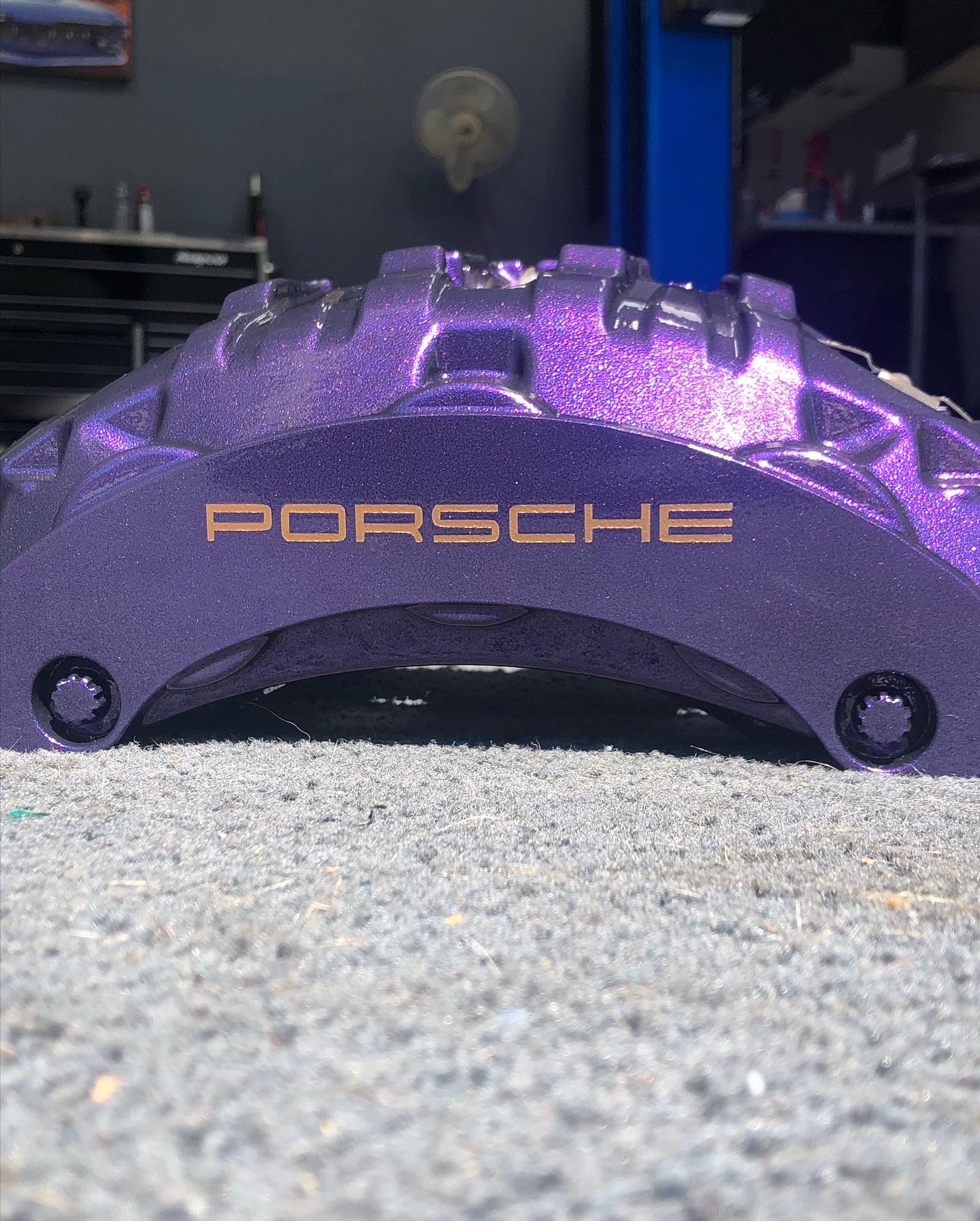 Custom powder-coated Porsche brake caliper