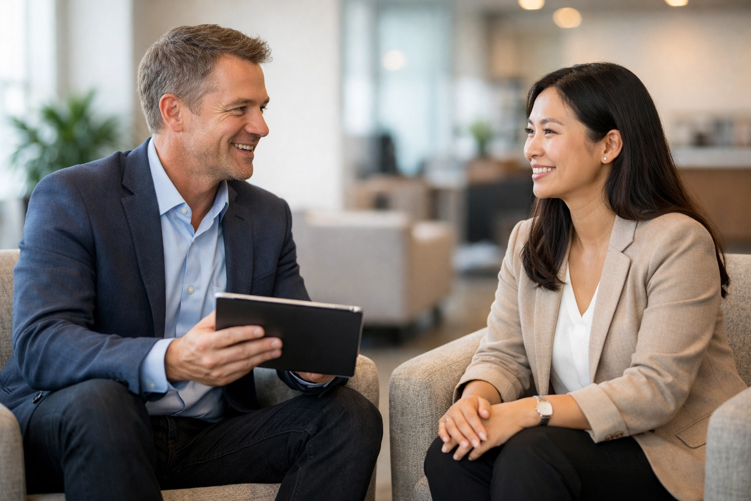 Tax professionals using a tablet to ensure client satisfaction through modern e-file operations.