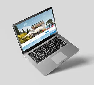 Laptop displaying a custom luxury property real estate website