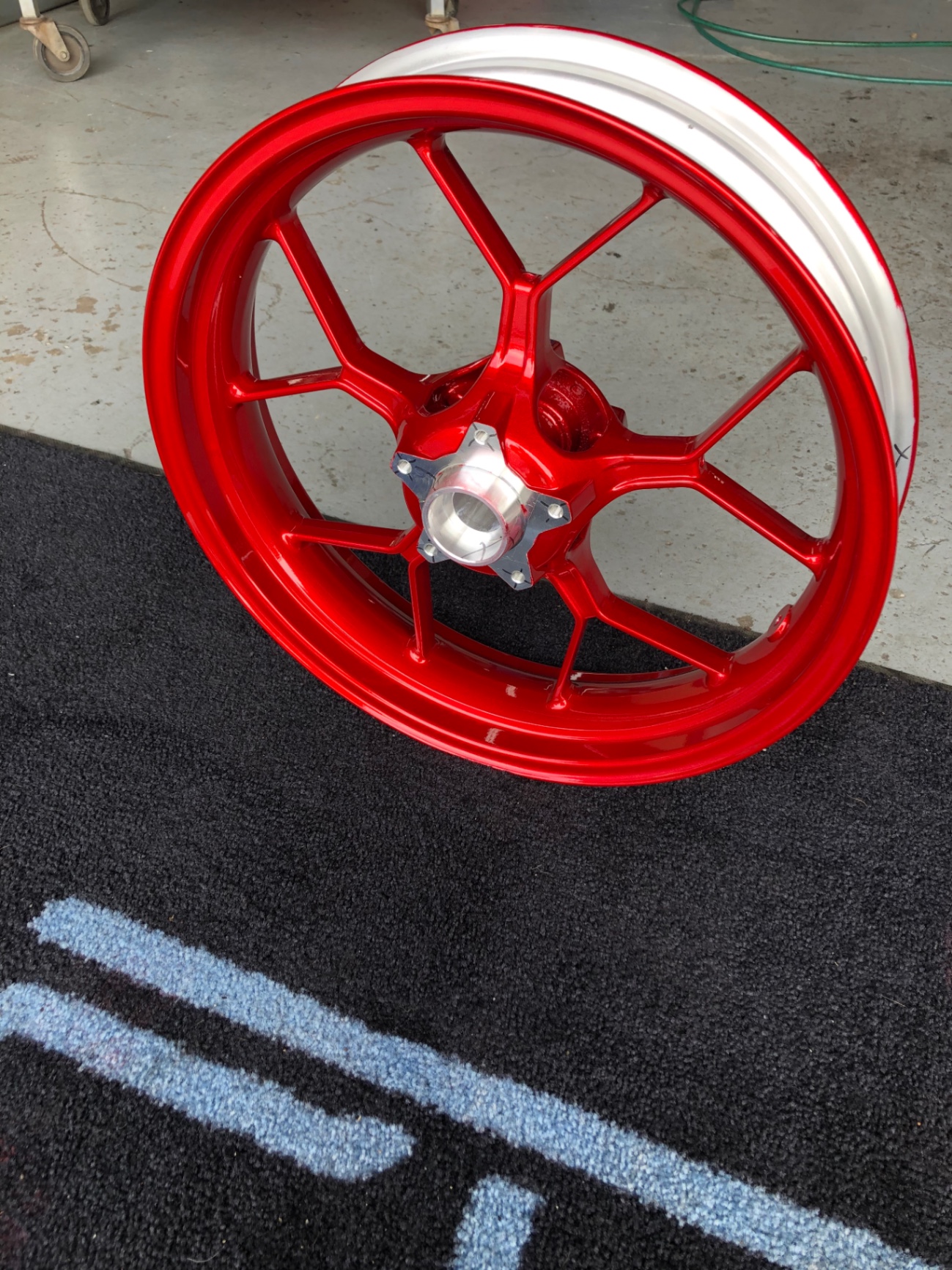 Gloss red powder coated motorcycle wheel with machined silver lip