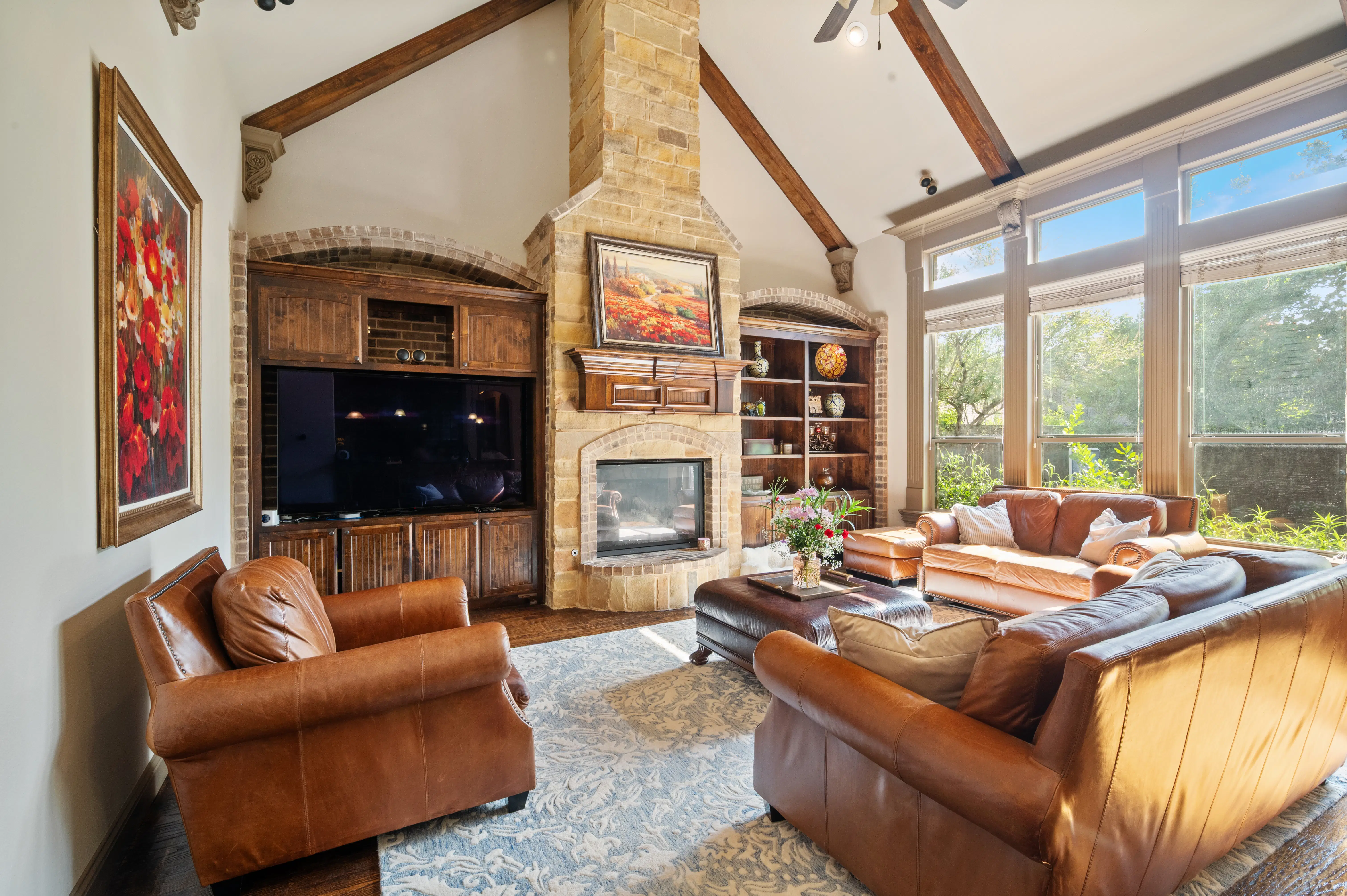 Bright sunlit living room with high ceilings and contemporary decor