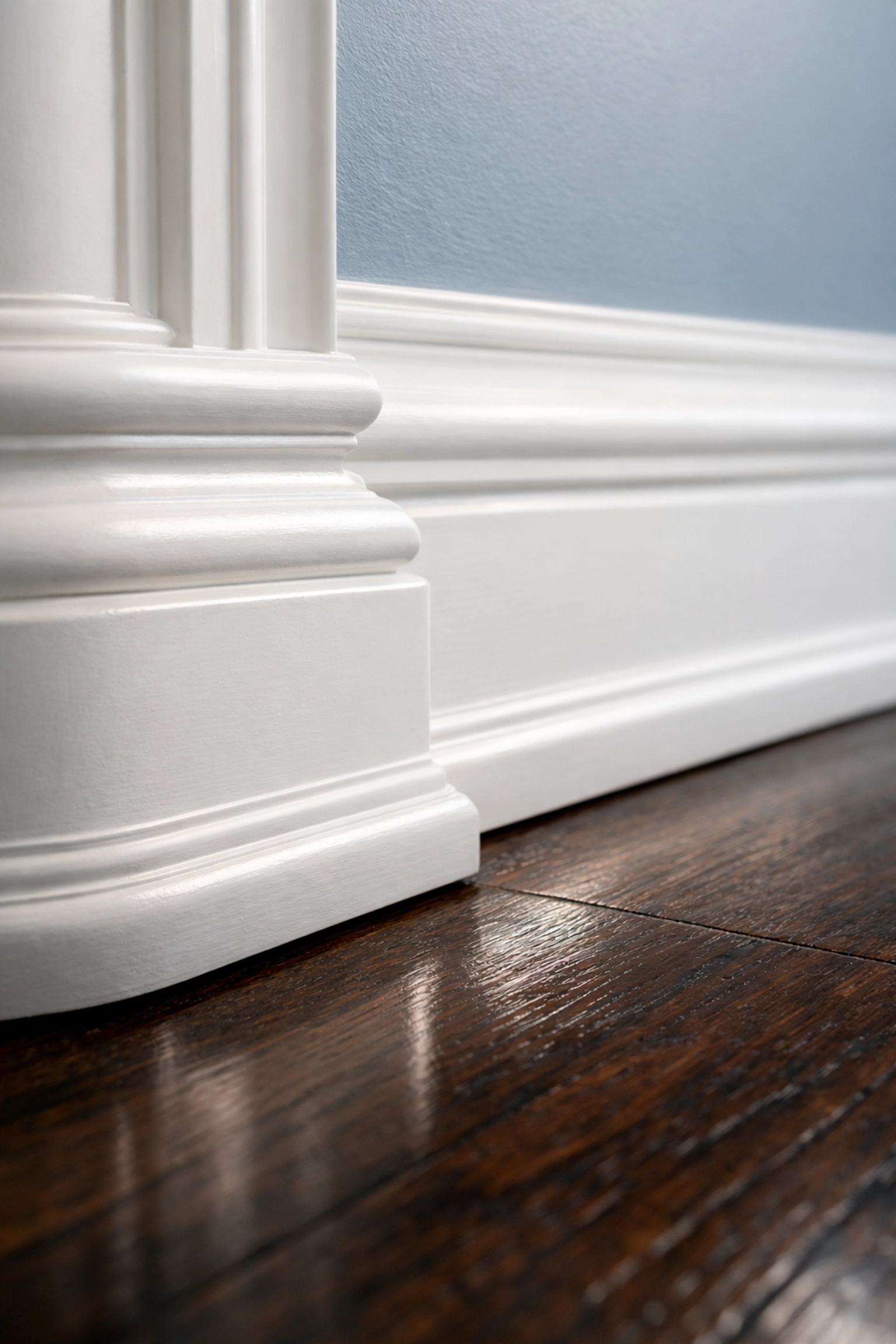 Dust-free white baseboards and hardwood floors in a Massachusetts apartment after a move-in deep clean.