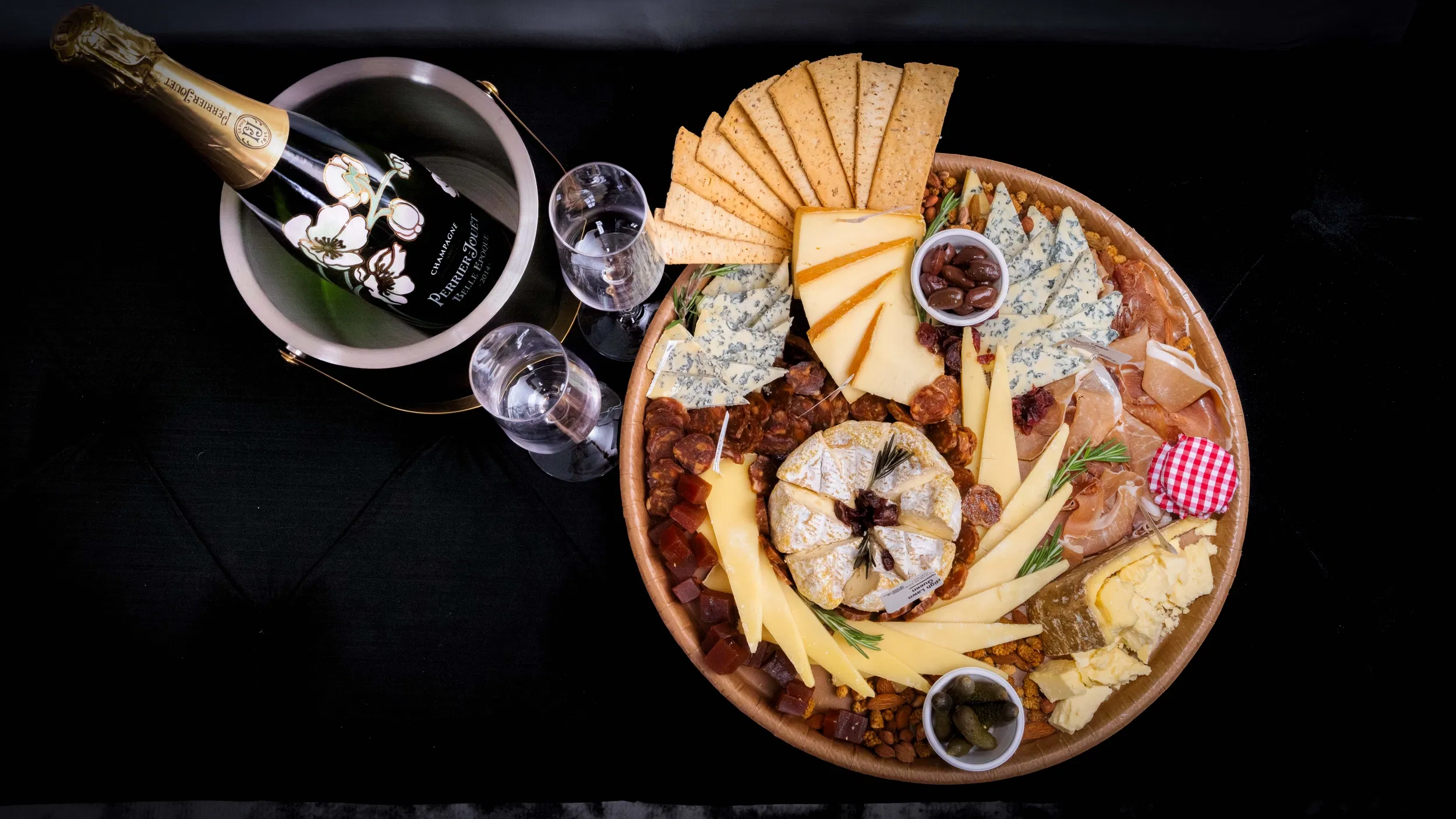 Luxurious charcuterie board and champagne at Garden Gables in Lenox, Massachusetts