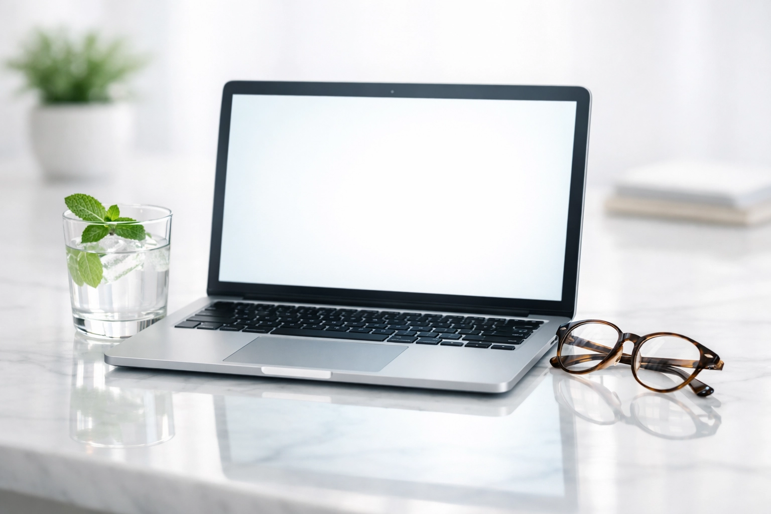 High-end laptop on a marble desk showing fast website loading speeds and professional digital marketing.