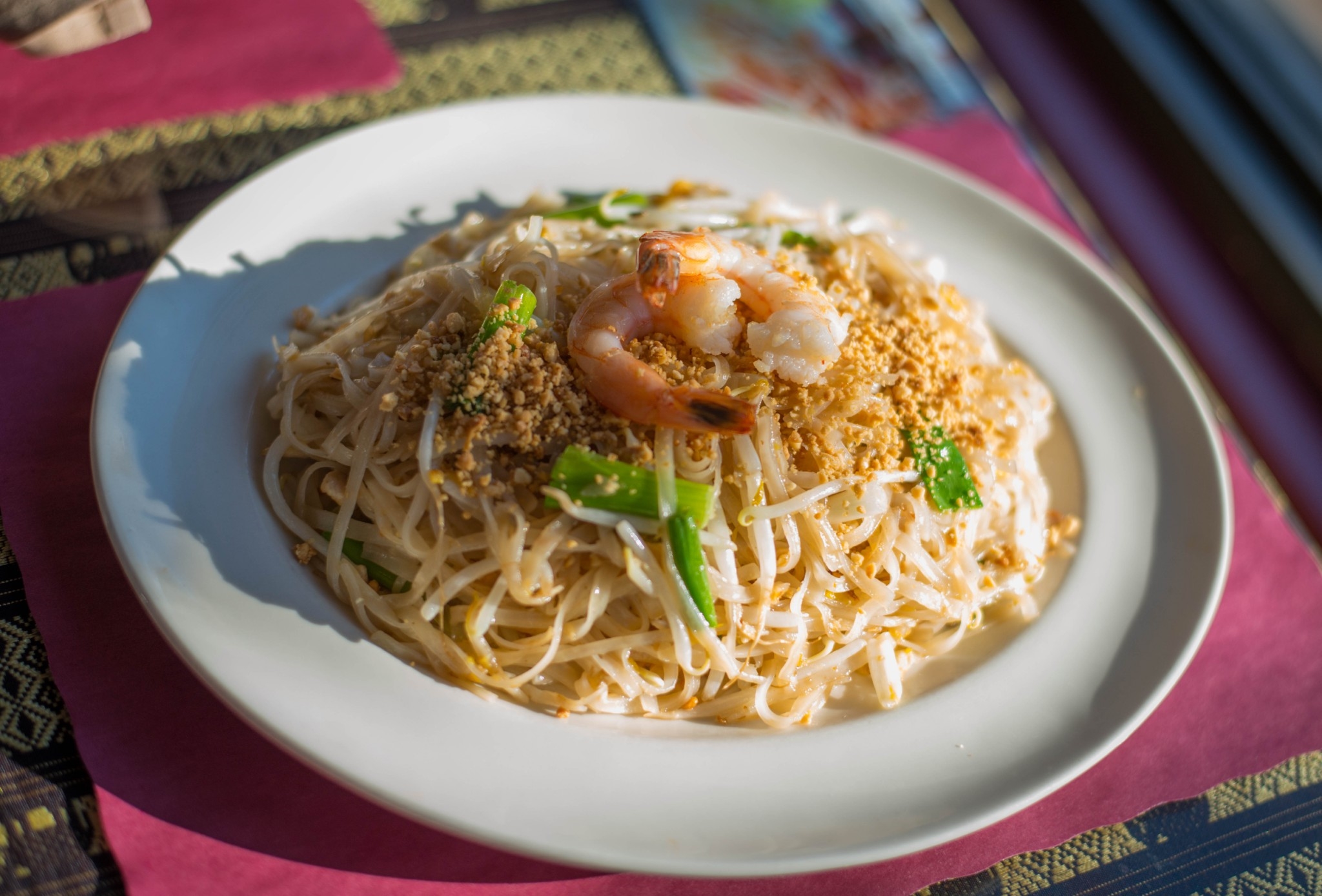 Pad Thai—glossy, caramelized noodles with fresh lime (authentic photo)
