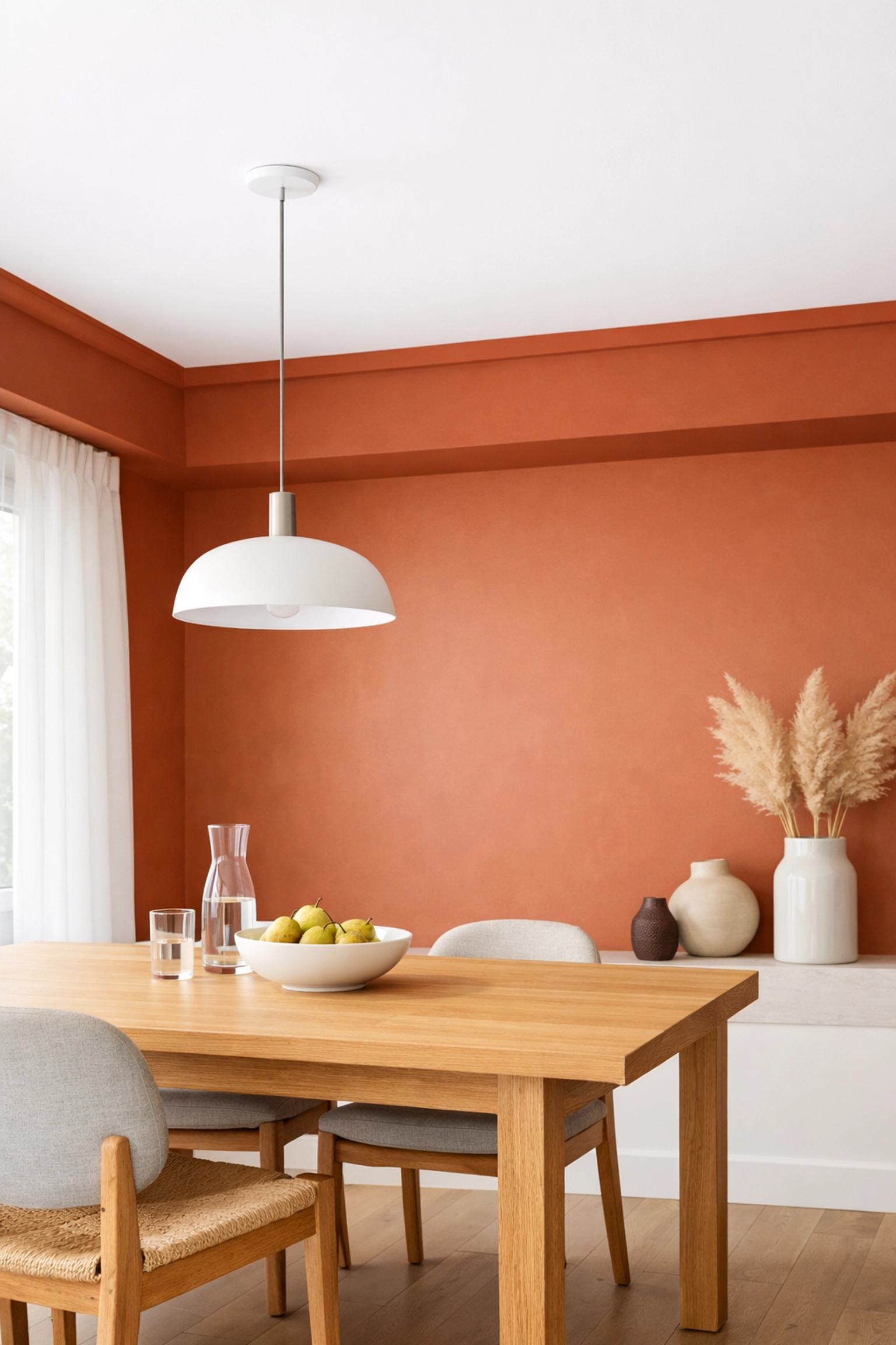 Contemporary dining room showing terracotta colour capping, a popular 2026 decorating trend in Gloucestershire.
