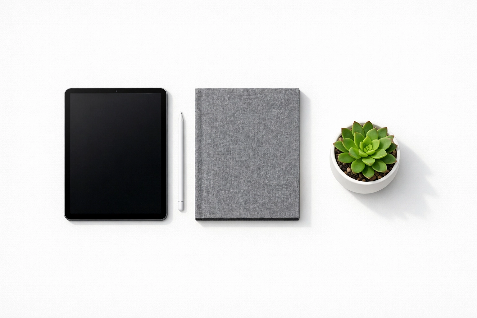 Digital tablet and notebook organized on a desk illustrating streamlined client intake for a new tax firm.