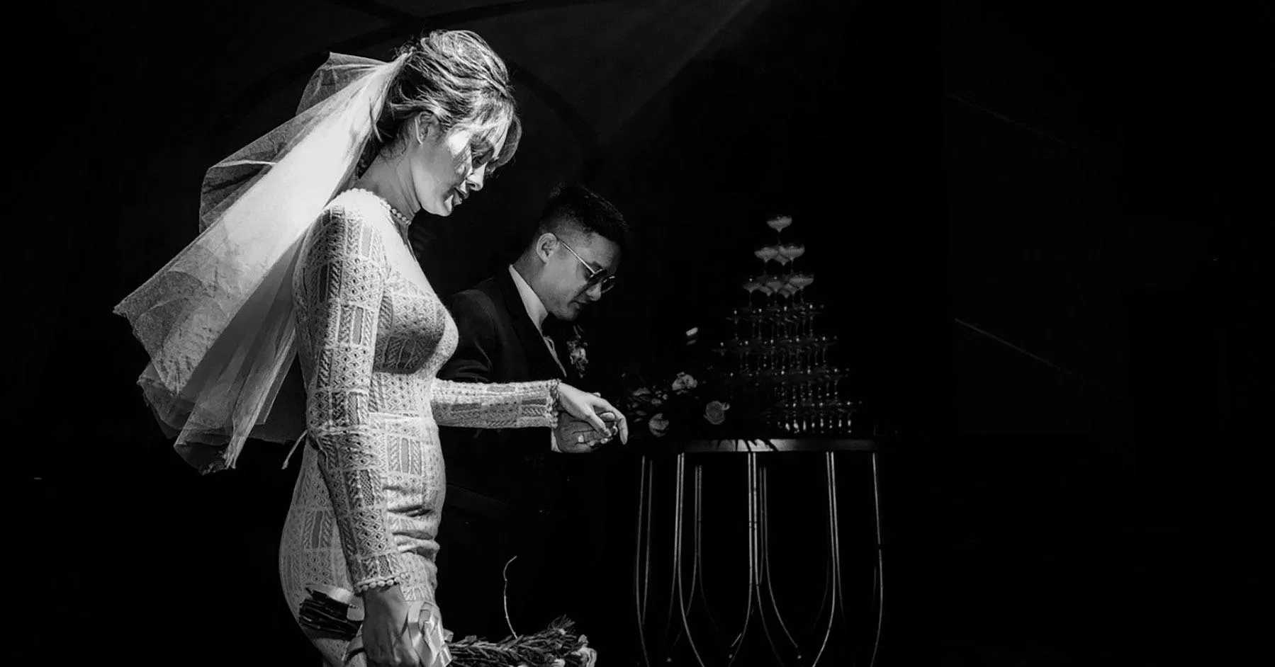 High-contrast black and white editorial wedding portrait