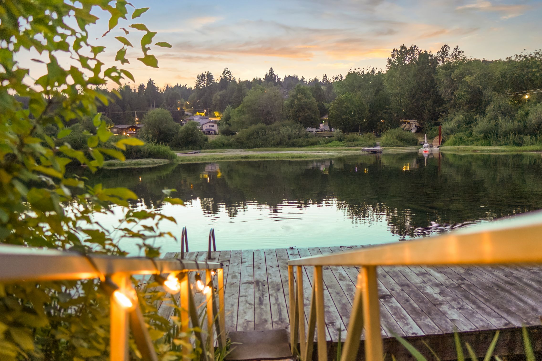 Private dock at Cowichan Lake Cottages A real lakeside dock with chairs for morning coffee and sunset hangs, calm water, and that classic Cowichan Lake view.