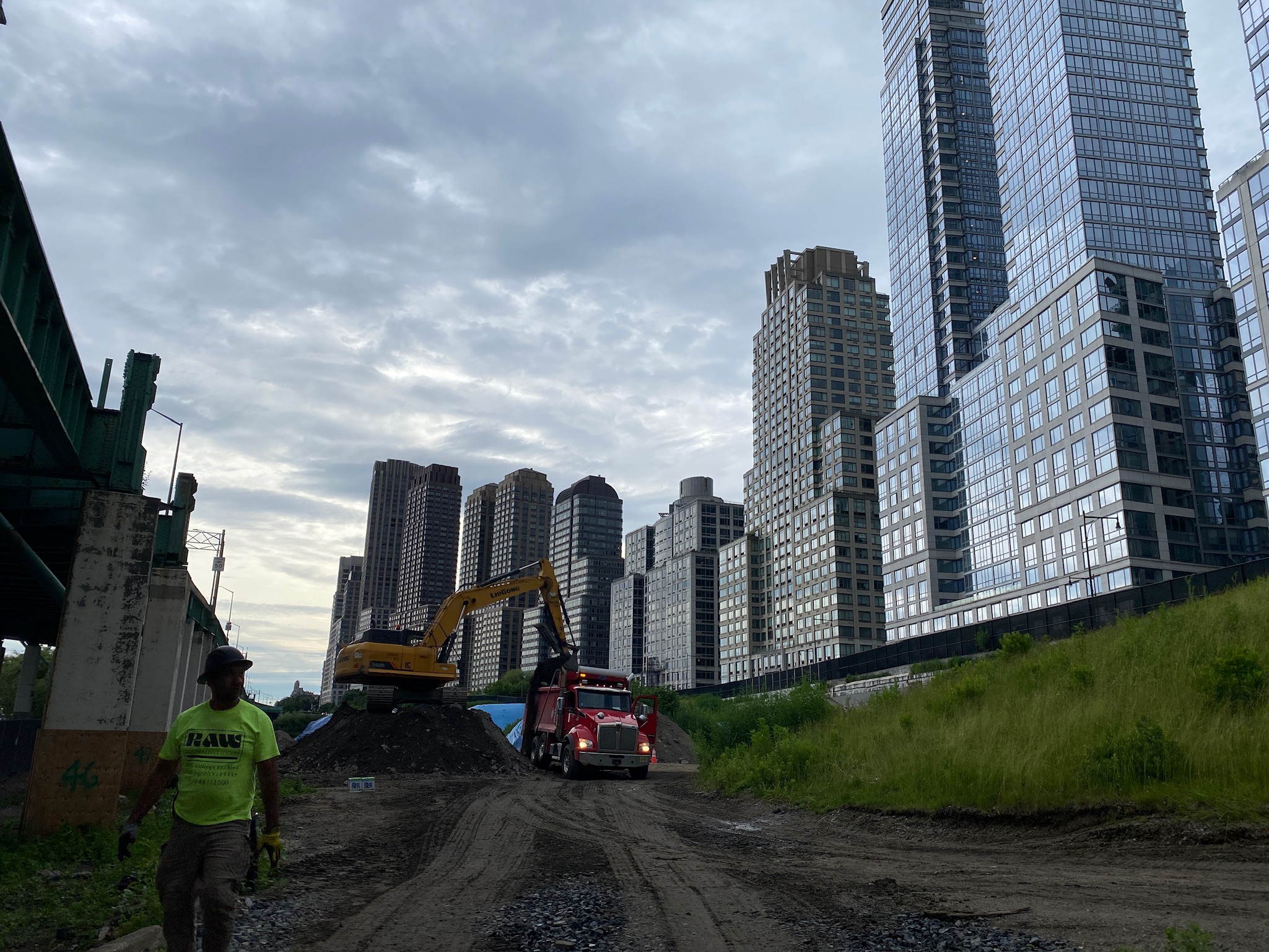 Excavator Loading Soil at Urban Redevelopment Site