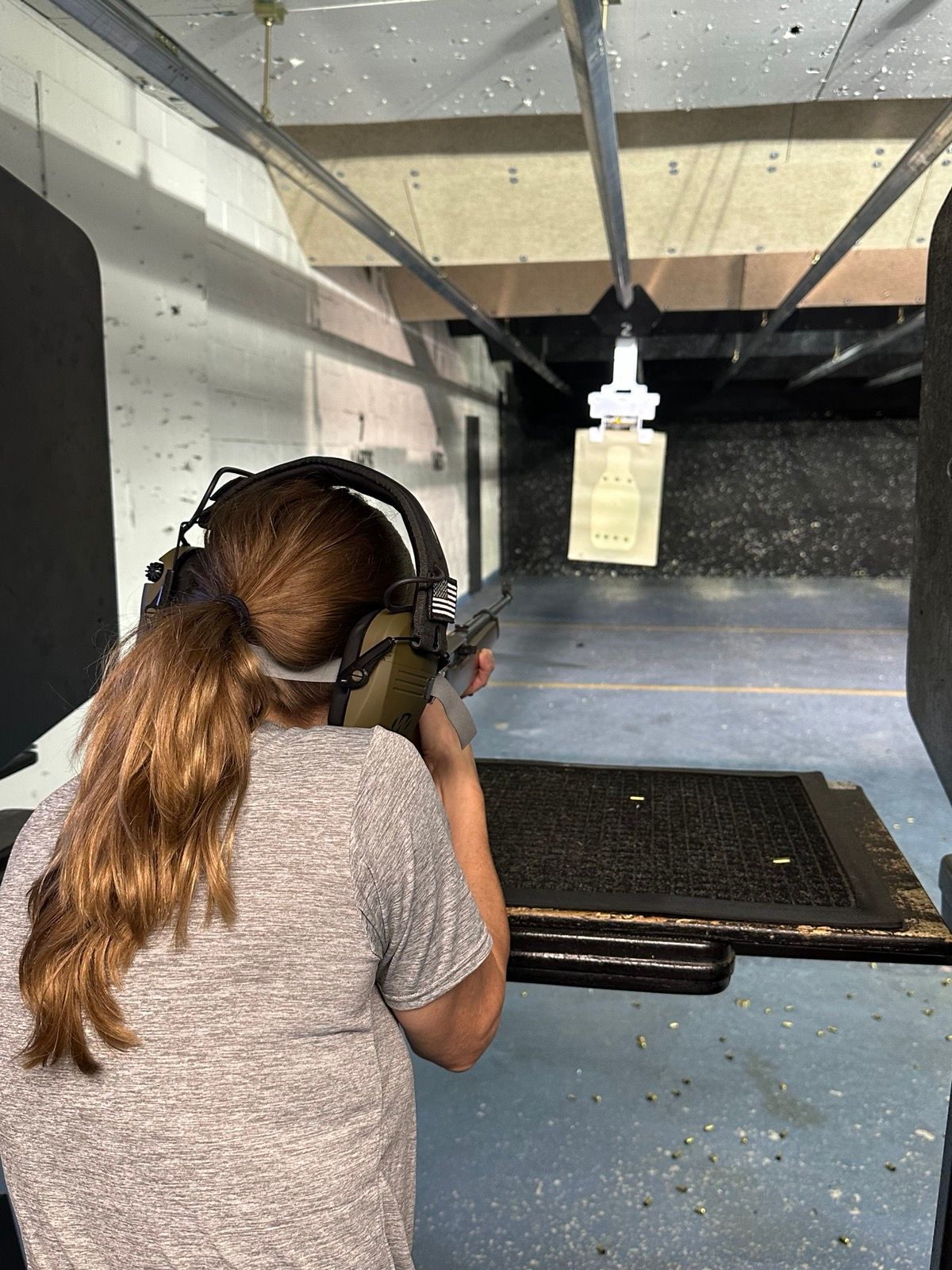 One-on-one private coaching session (student with eye and ear protection)