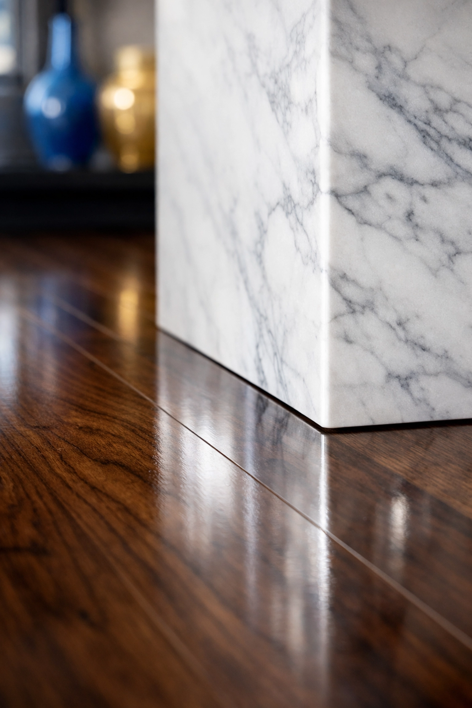 Deep cleaning results on polished hardwood floors and marble kitchen island in a Westford home.