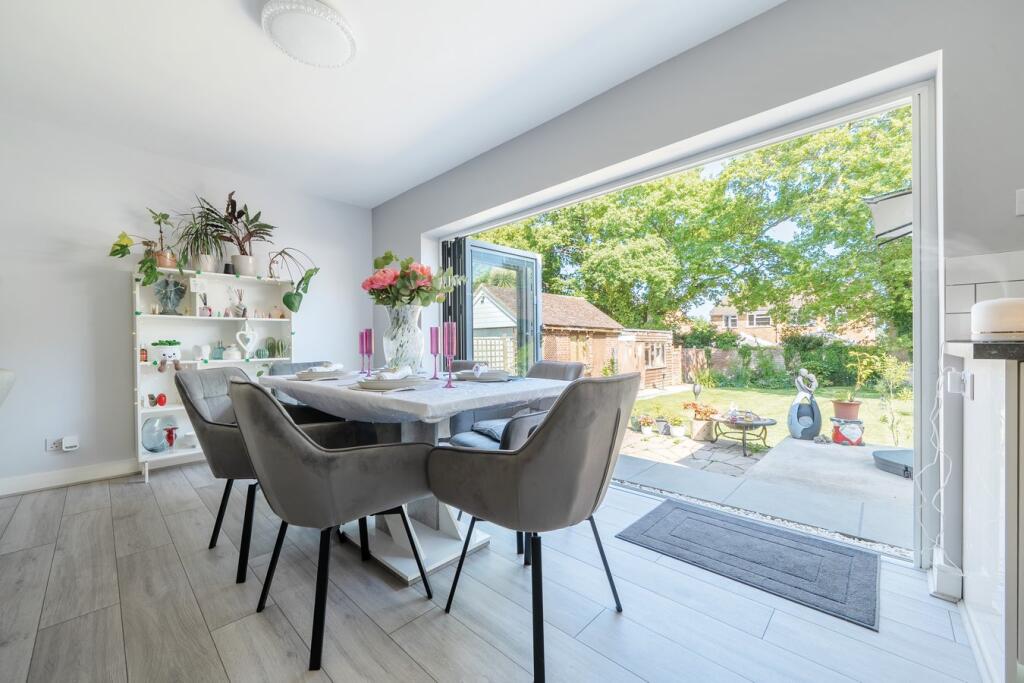 Bright dining area with large glass doors