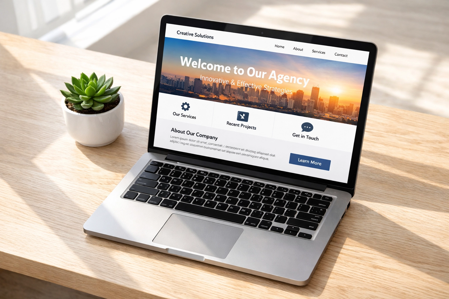 Modern laptop on a white desk displaying a custom WordPress website design for a local business.