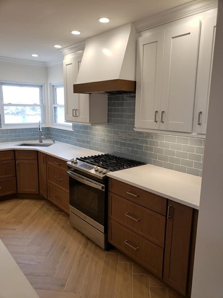 Long Island custom kitchen design with two-tone custom cabinets, natural wood base cabinetry, and biophilic styling
