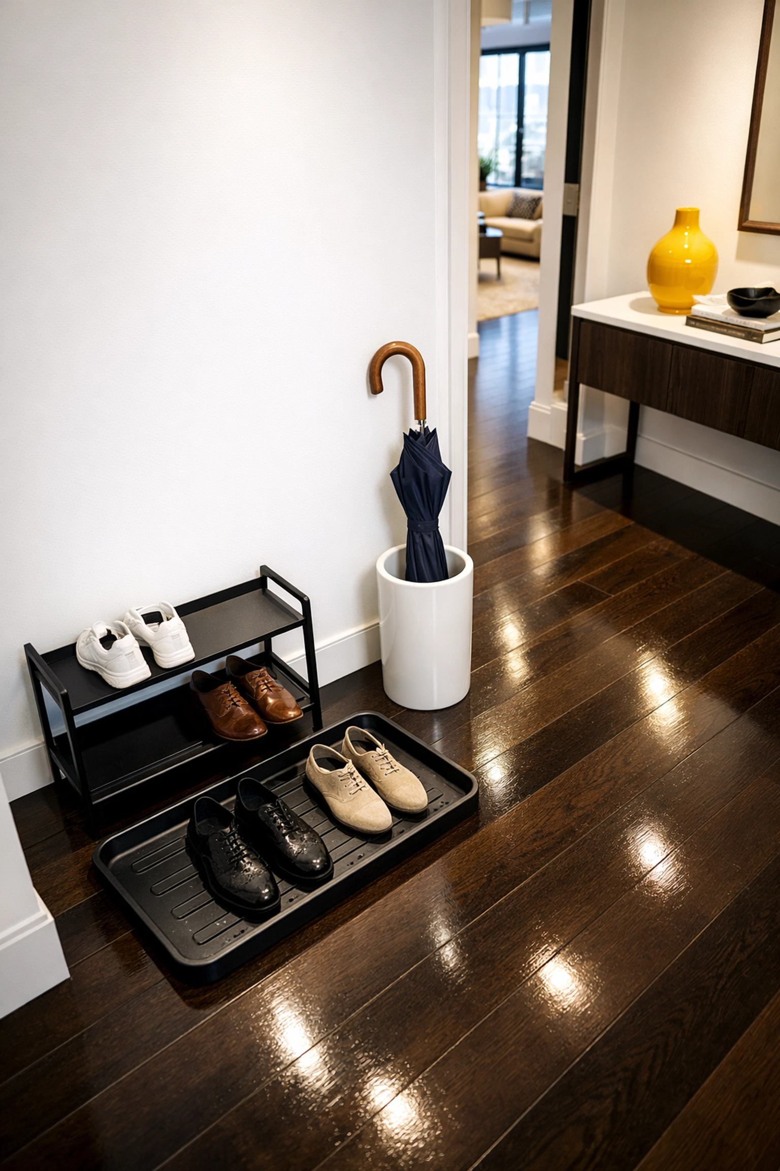 Clean Boston apartment entryway featuring a shoe rack to maintain spotless hardwood floors.