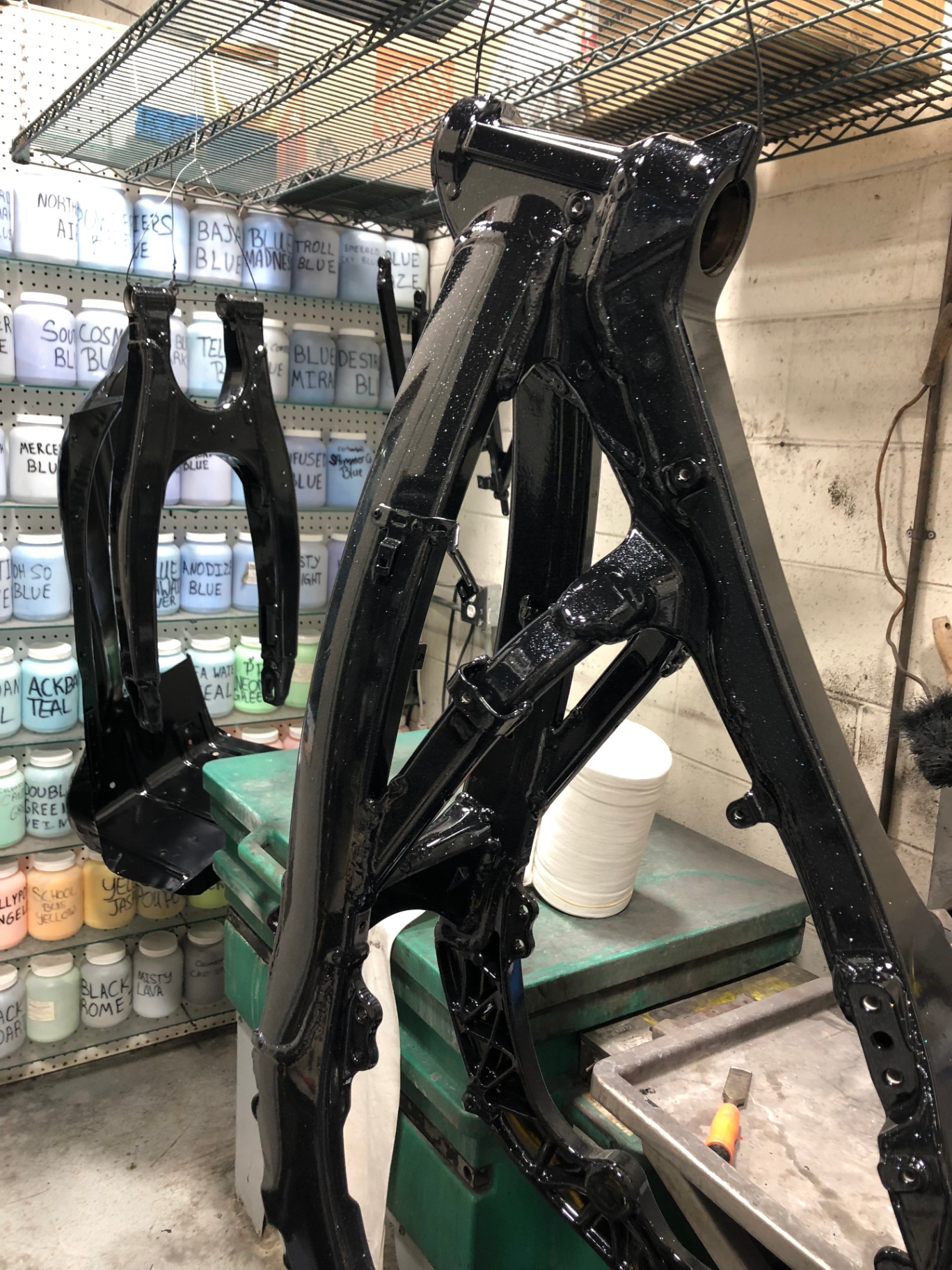 Freshly powder-coated motorcycle frames