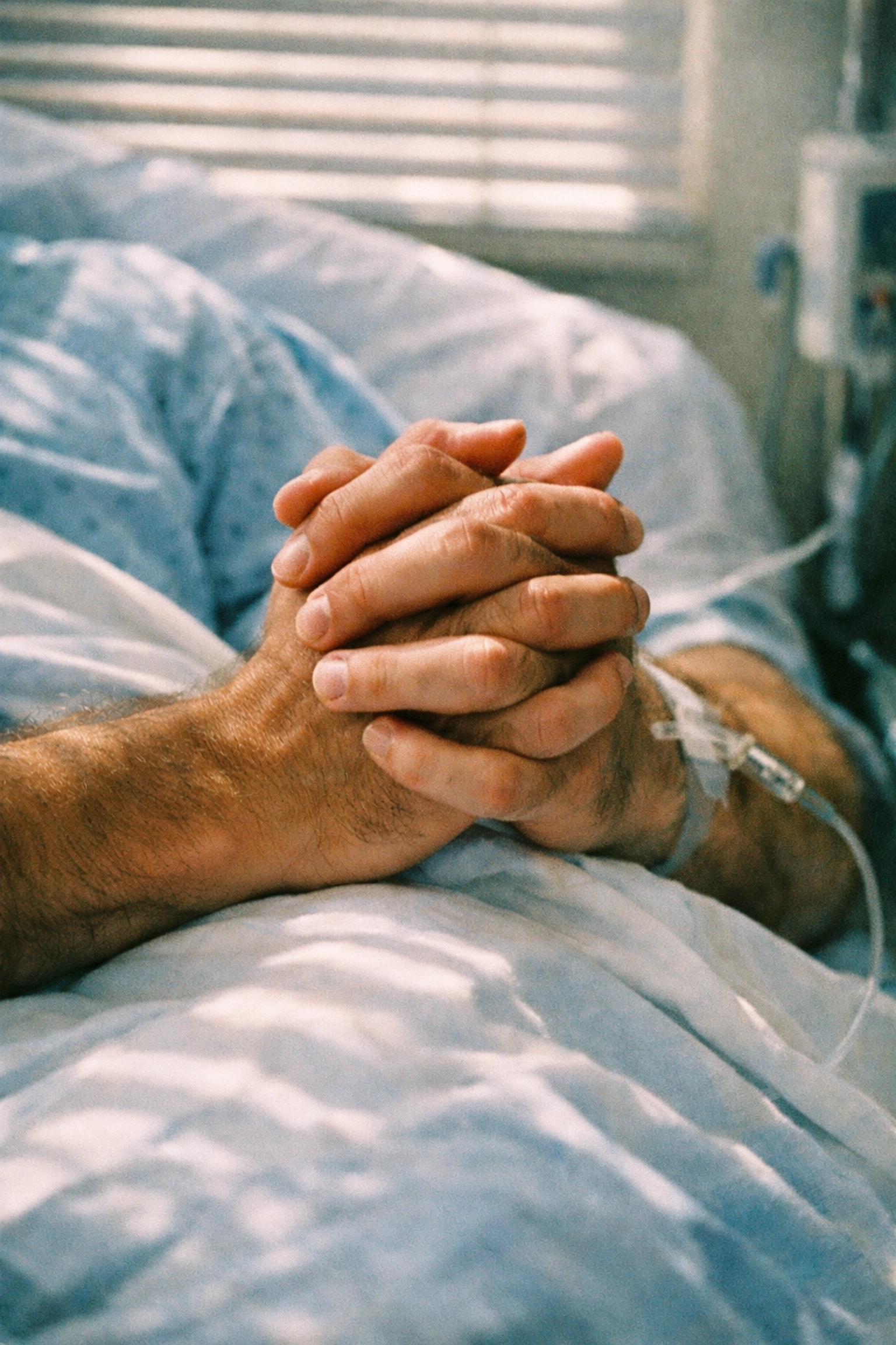 Two men holding hands in hospital during AIDS crisis - Holding the Man gay love story support