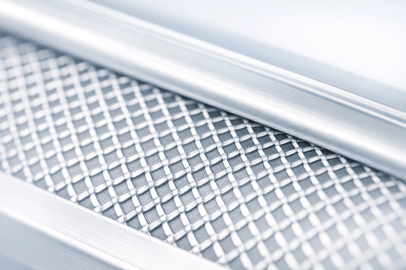 Close-up of durable LeafFree aluminium gutter guard mesh with an ember-proof diamond pattern.