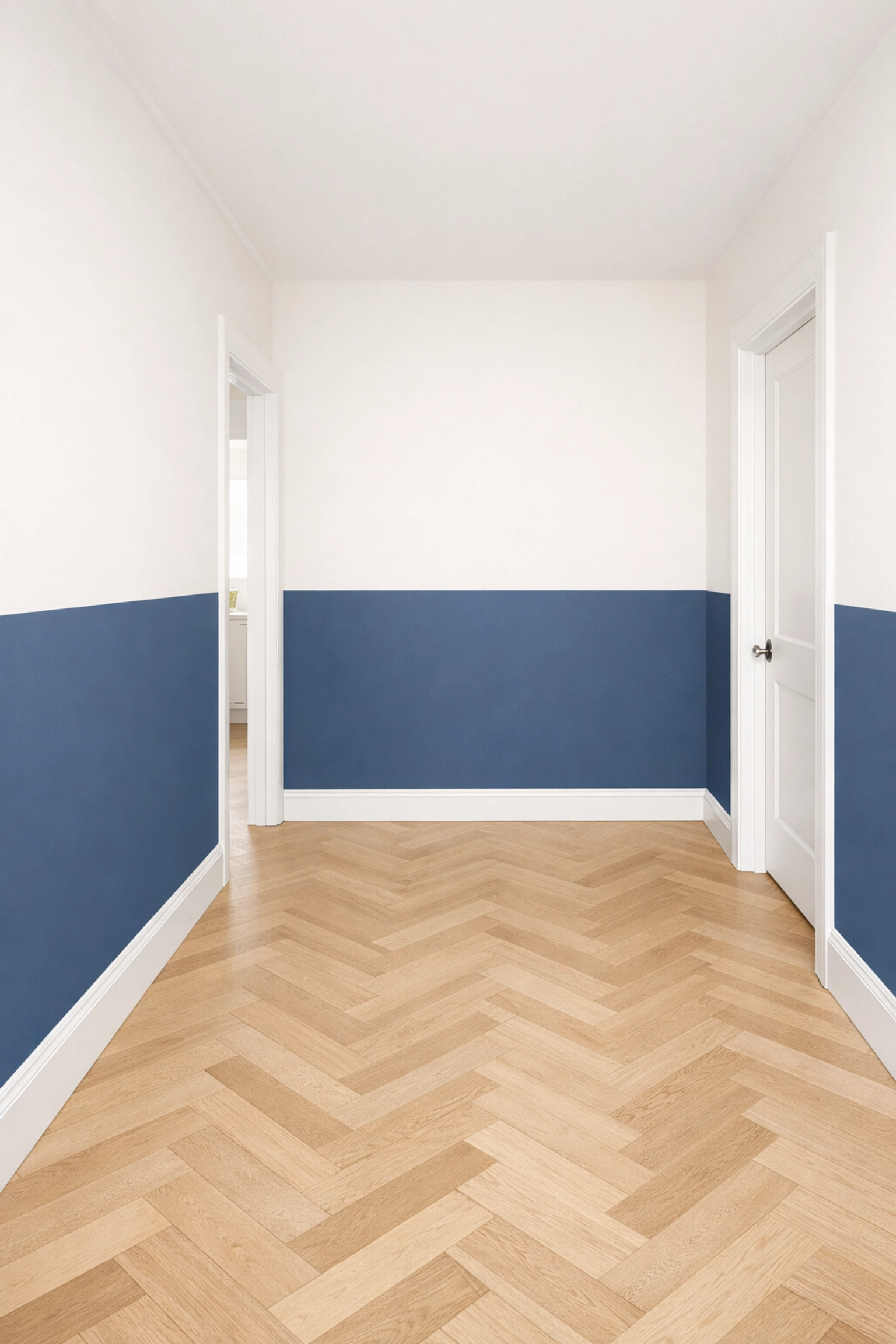 Bright hallway with a sharp two-tone paint finish in navy blue and off-white by professional decorators.
