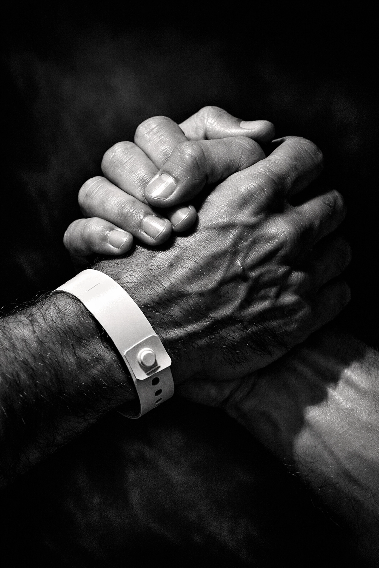 Two gay men holding hands tightly, representing the hidden strength of LGBTQ+ love in Iran.