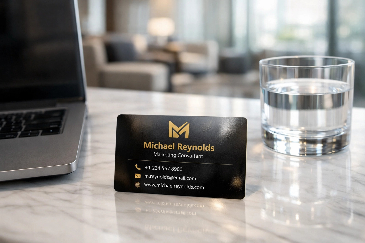A premium digital business card resting on a professional marble desk next to a laptop in a modern office.