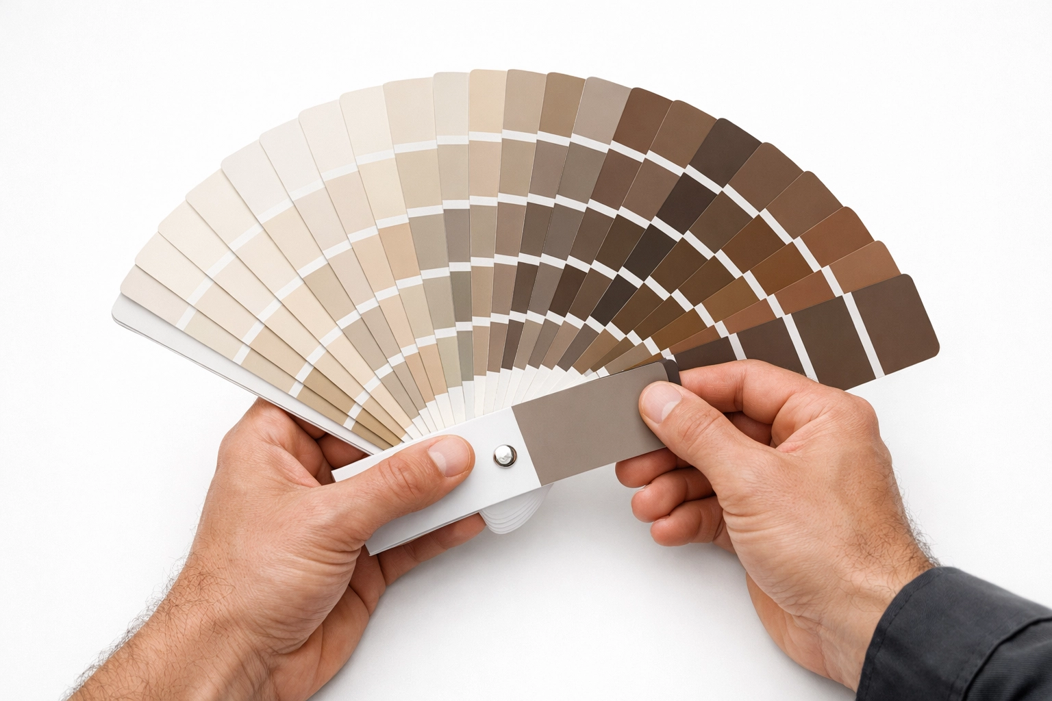 Decorator holding paint swatches for professional colour consultation in Cheltenham.