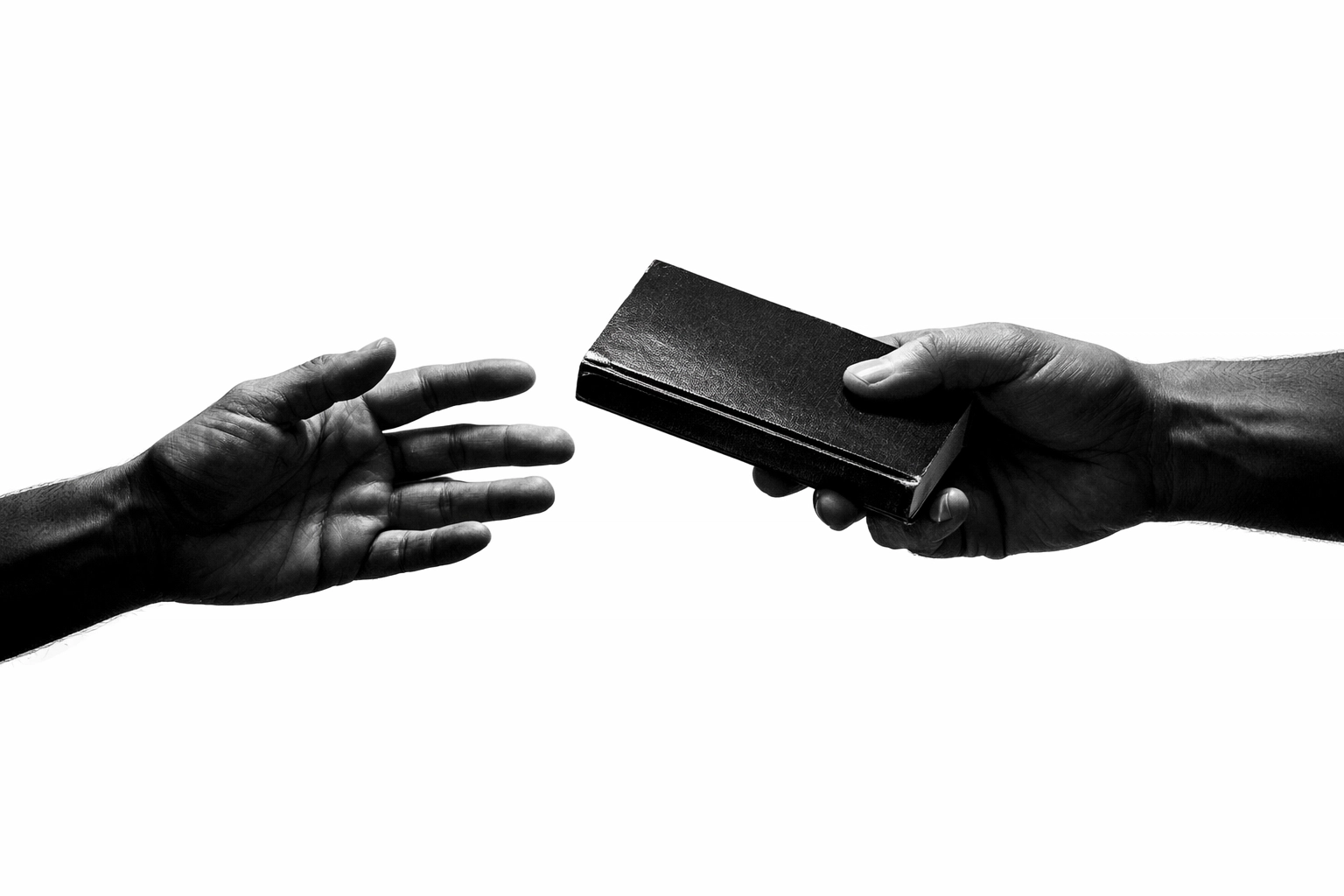 Two hands sharing a short book recommendation between strangers