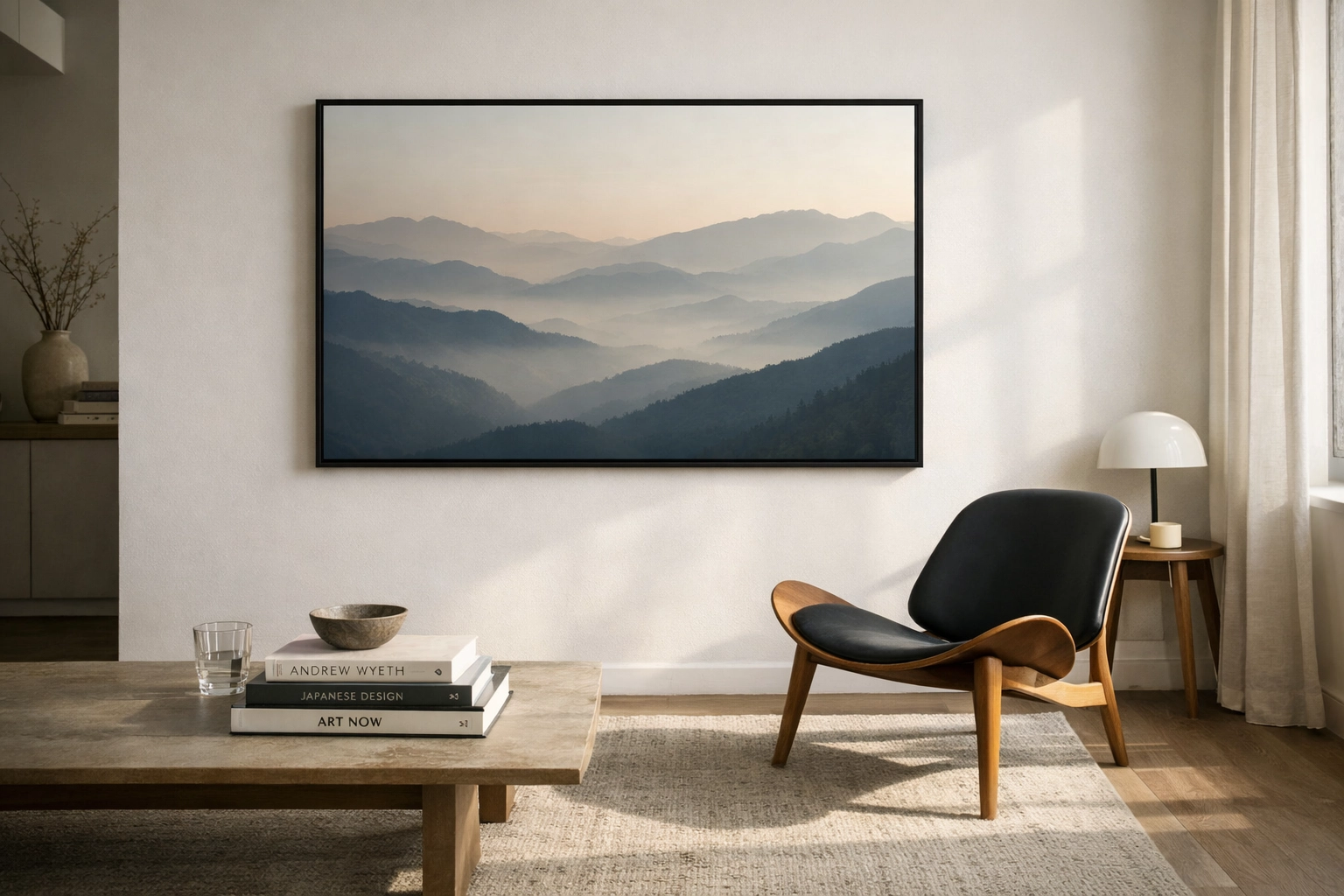 Framed museum quality mountain landscape print displayed in a minimalist modern living room with natural light.