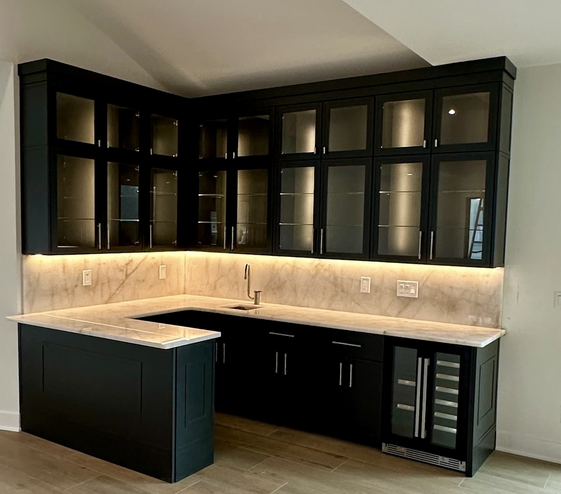 Seamless marble backsplash and custom cabinetry