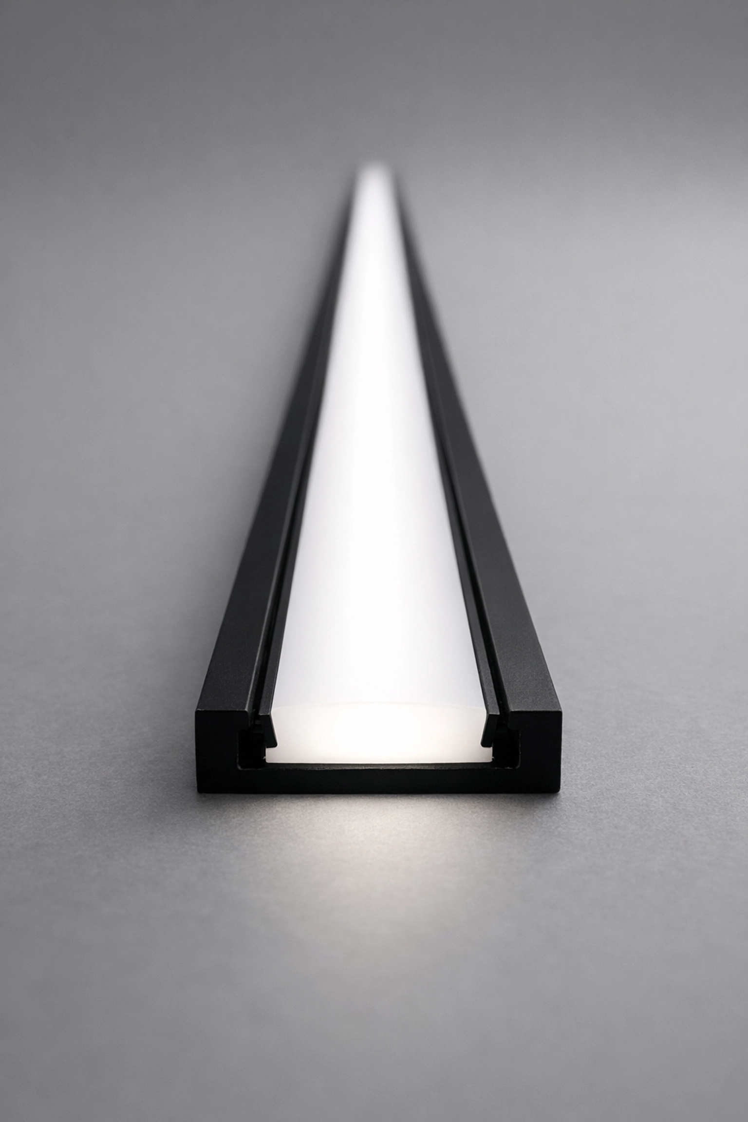 Sleek architectural LED channel with a frosted lens for professional, dot-free kitchen cabinet illumination.
