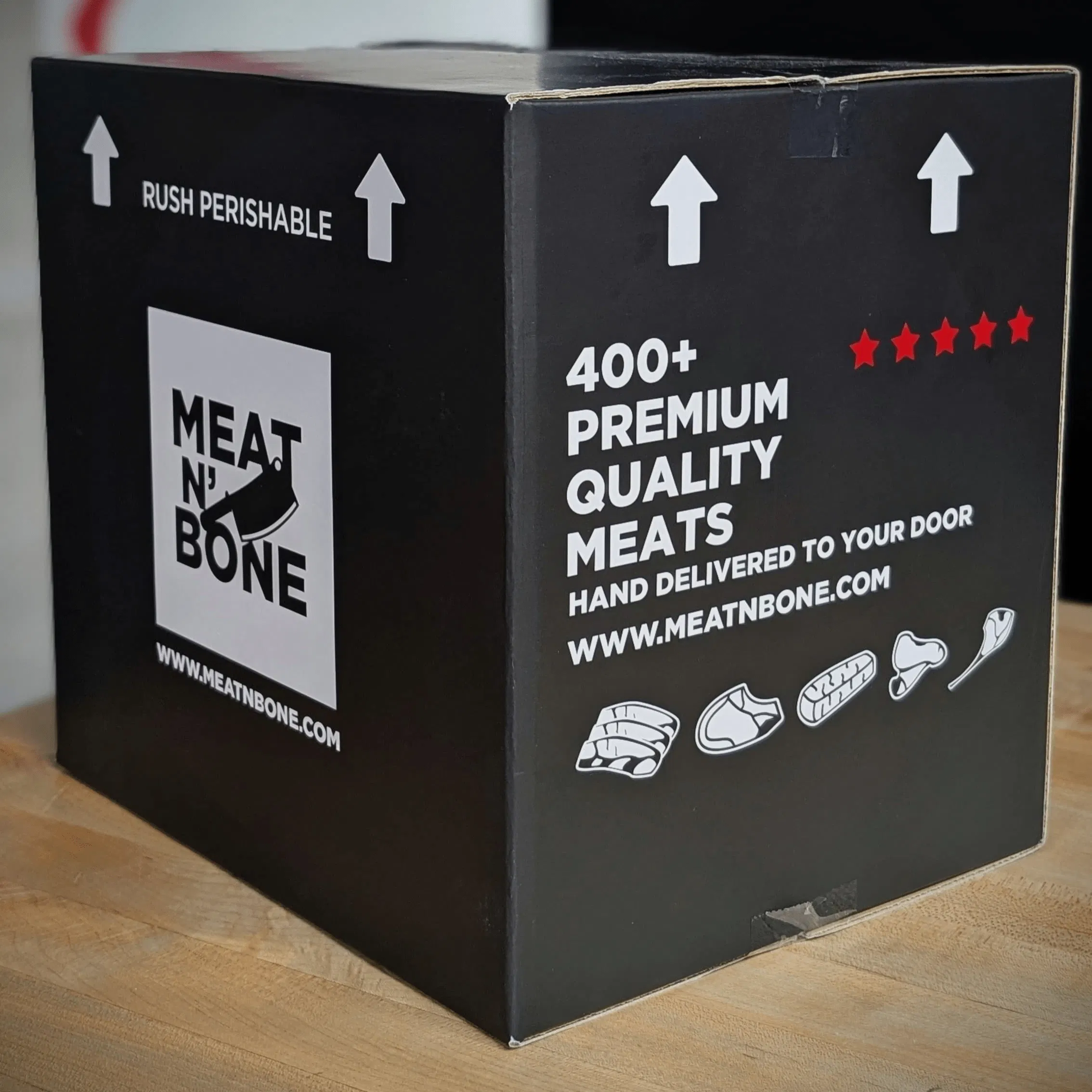 A Meat N' Bone branded shipping box ready for delivery