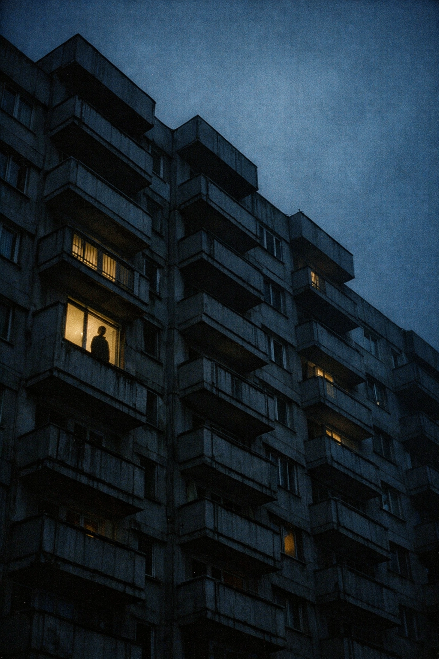 Gay student watching from apartment window in 1980s communist Bucharest under Securitate surveillance