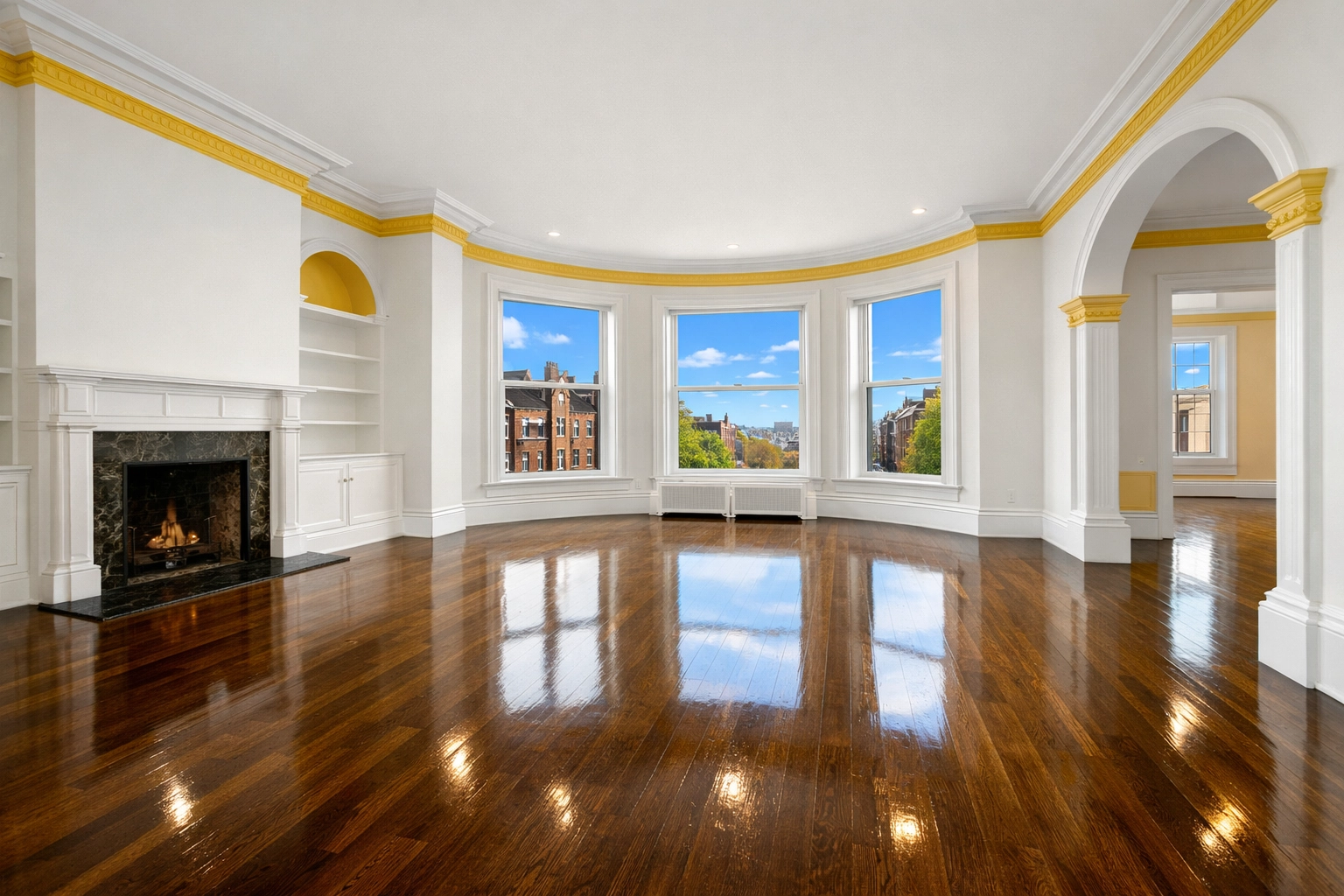 Empty Boston apartment living room with polished floors after a professional ninja-level move-out cleaning.