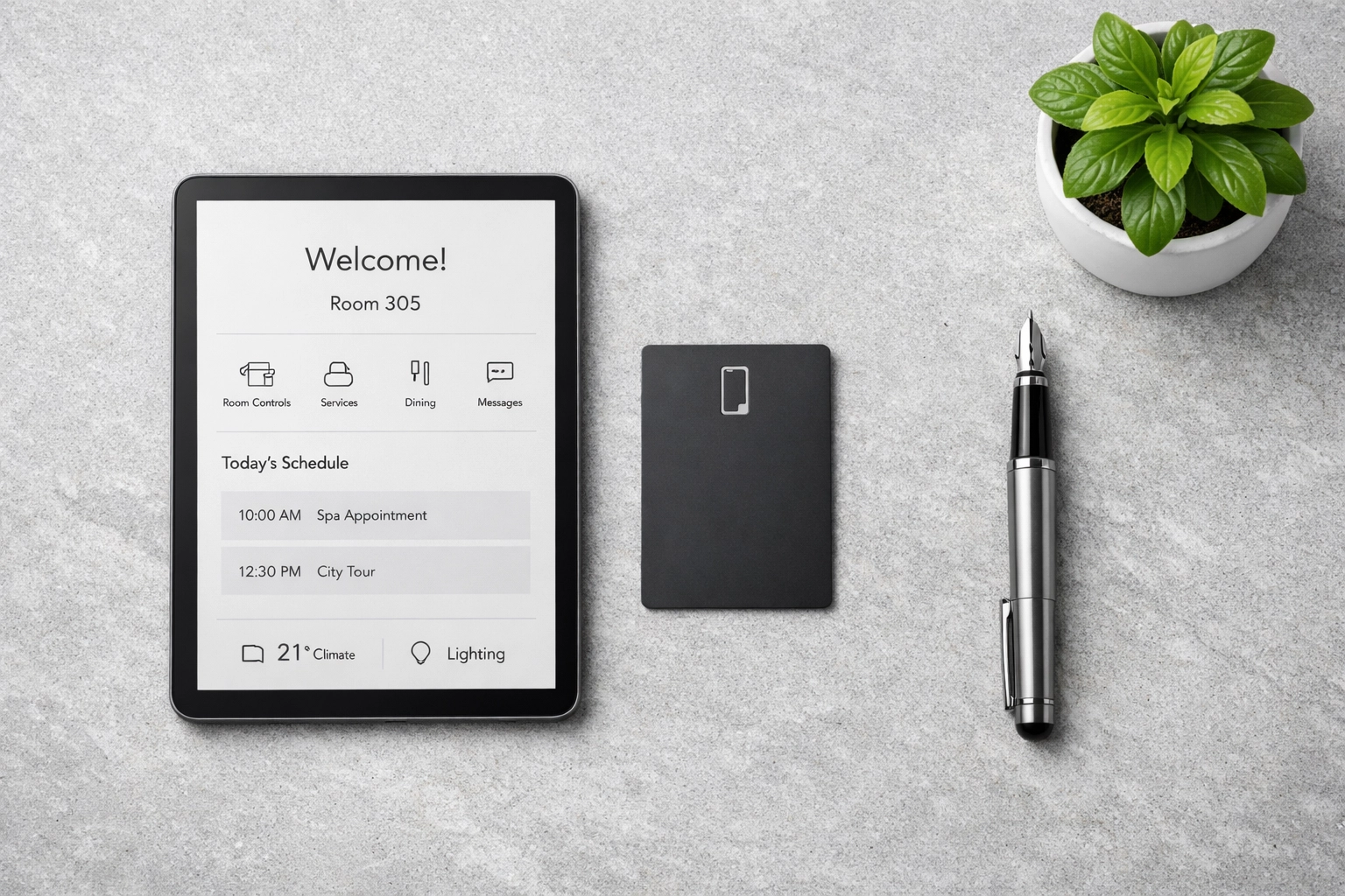 A tablet and room key card showing integrated tools connected to modern hotel management software.