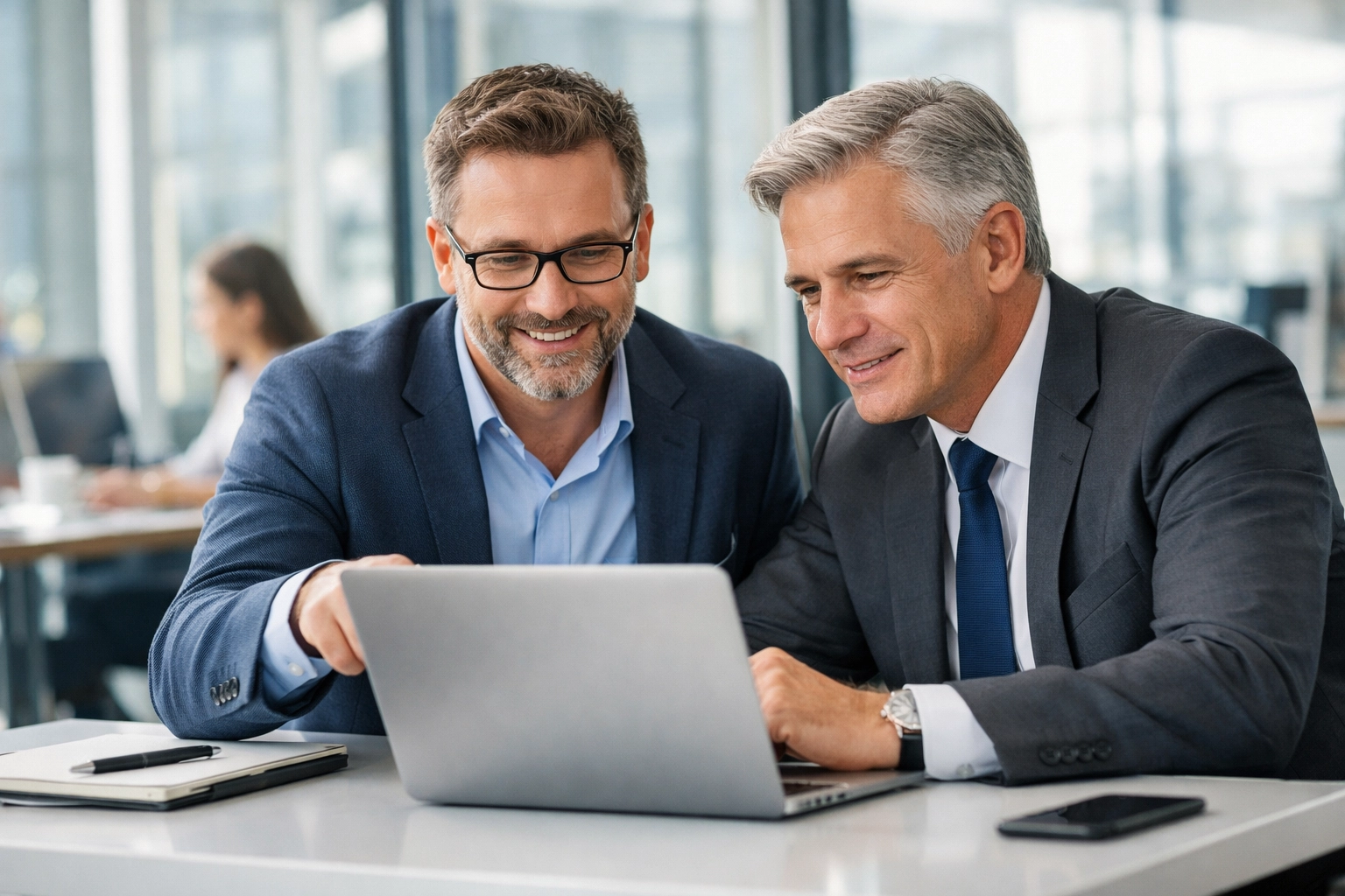 ServiceNow implementation partner and executive discussing strategic IT consulting in a modern office.