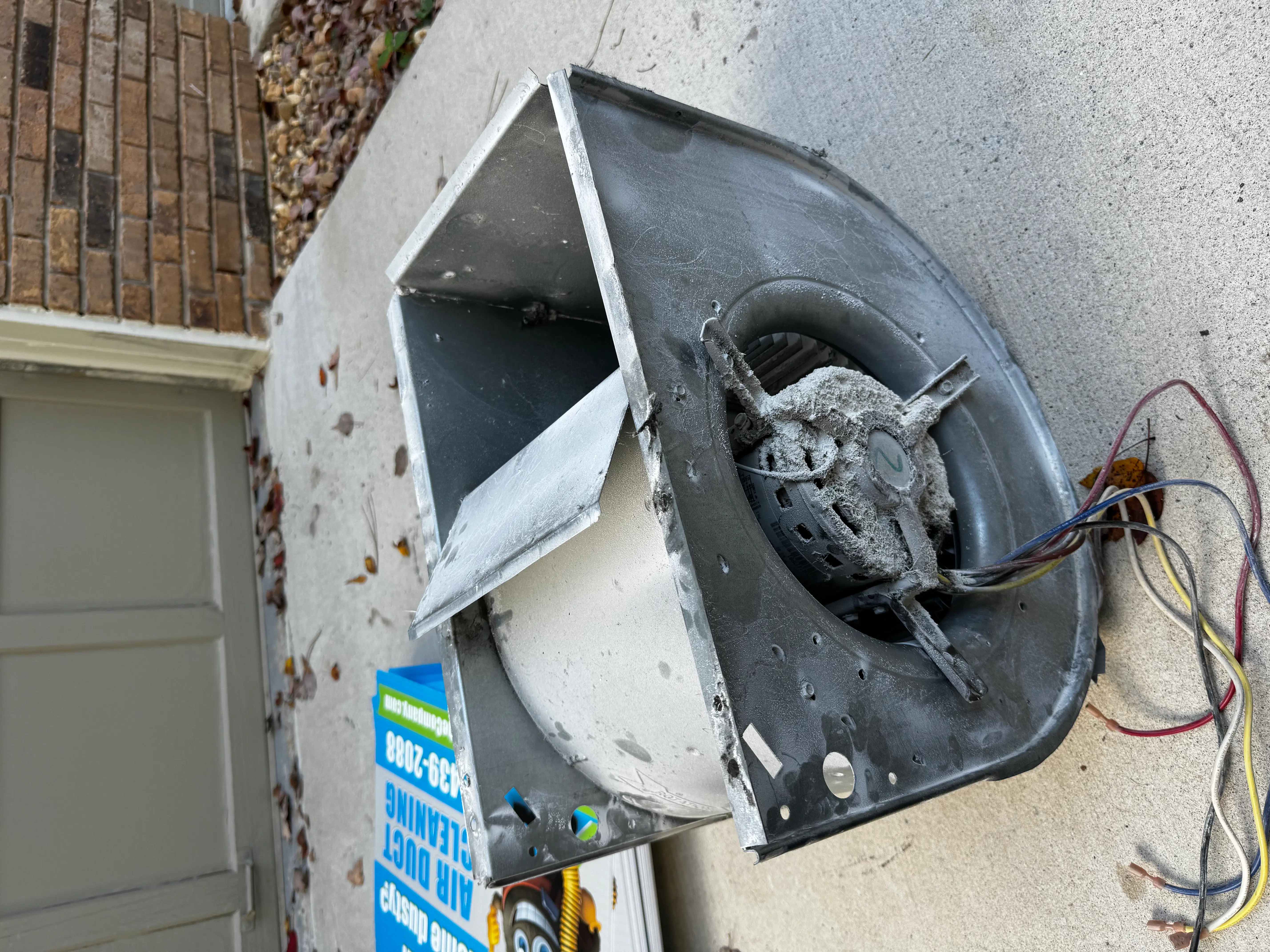 Dirty blower motor assembly removed during HVAC air duct cleaning service