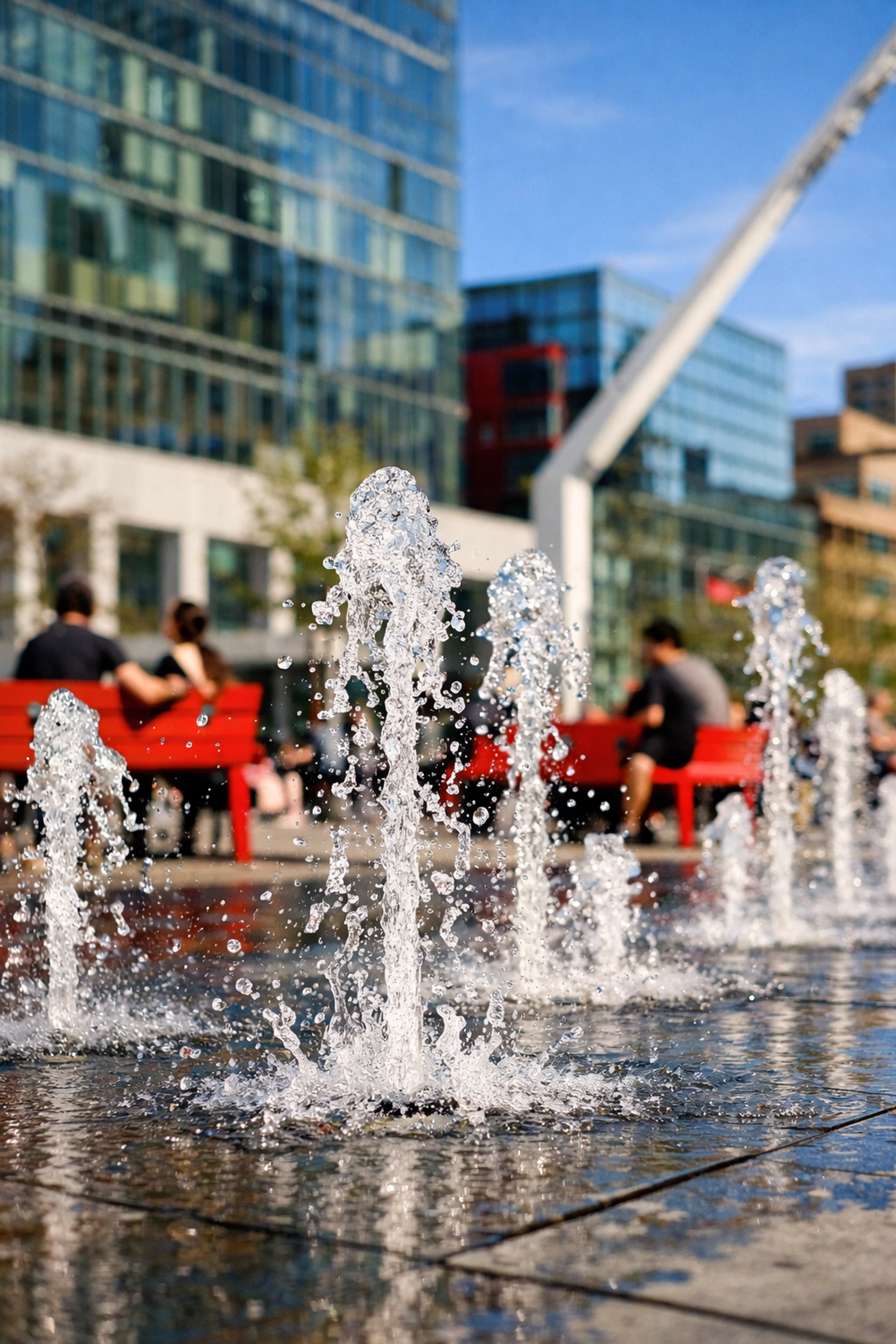 Interactive water fountains at Place des Festivals in Montreal's vibrant Quartier des Spectacles.