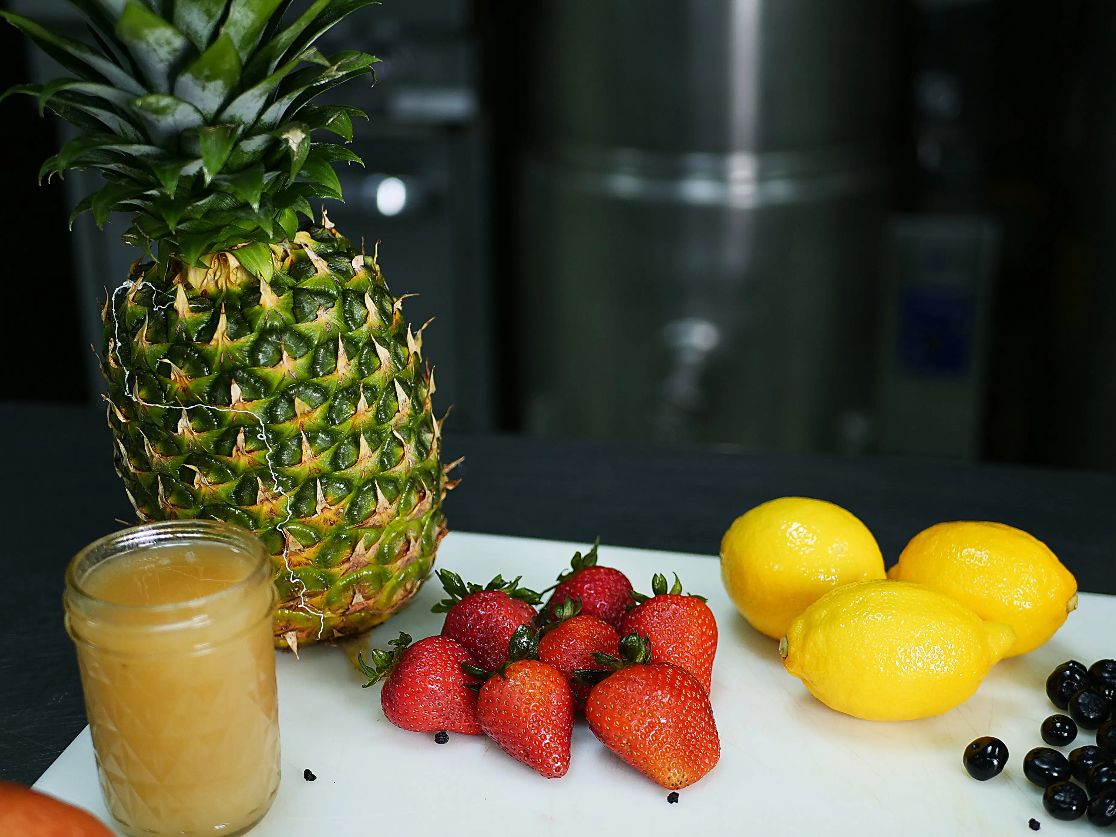 Fresh fruits and sea moss gel ingredients on a cutting board